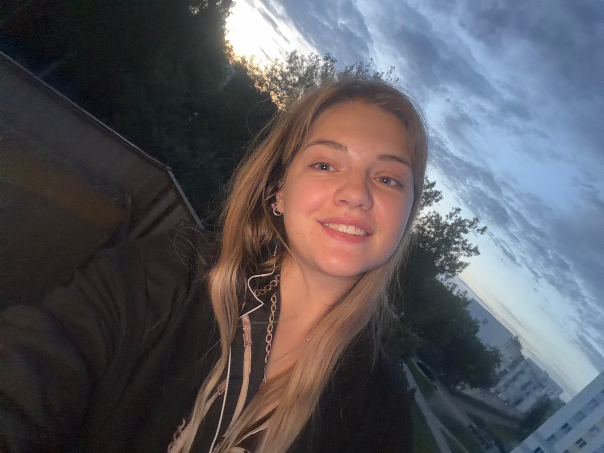 Woman documents evening stroll with selfies and cats in Russia