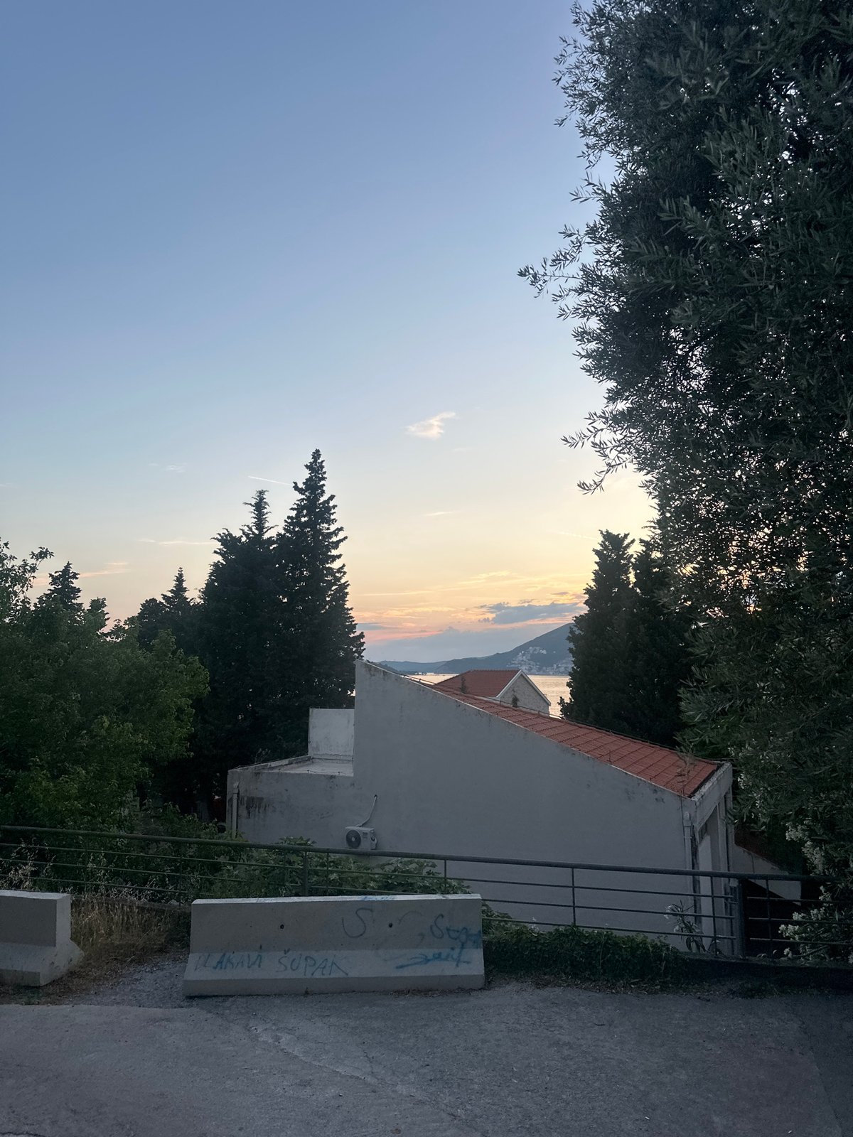 Coastal scenes documented in Podličak, Montenegro during evening hours
