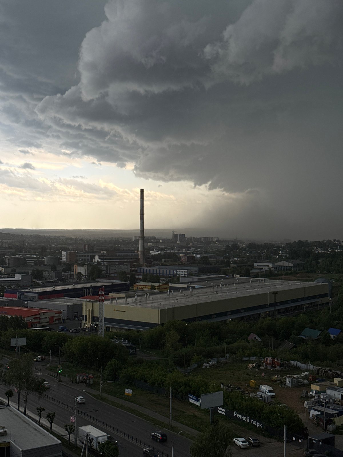 Storm clouds gather over Izhevsk as residents document weather indoors