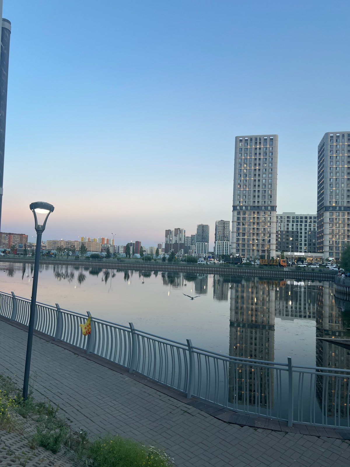 Evening stroll along Astana's waterfront promenade