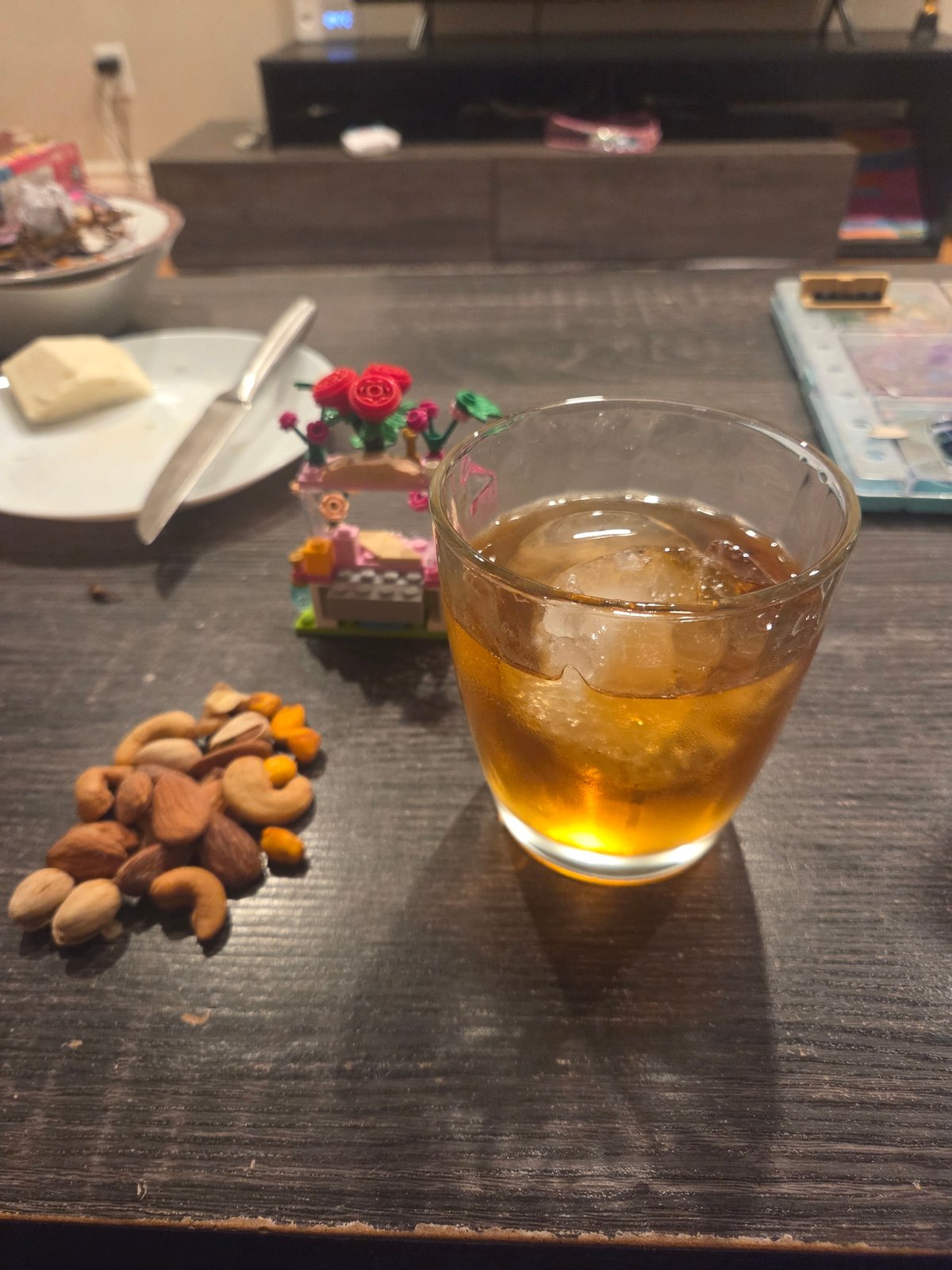 Evening table scene with amber beverage captured indoors
