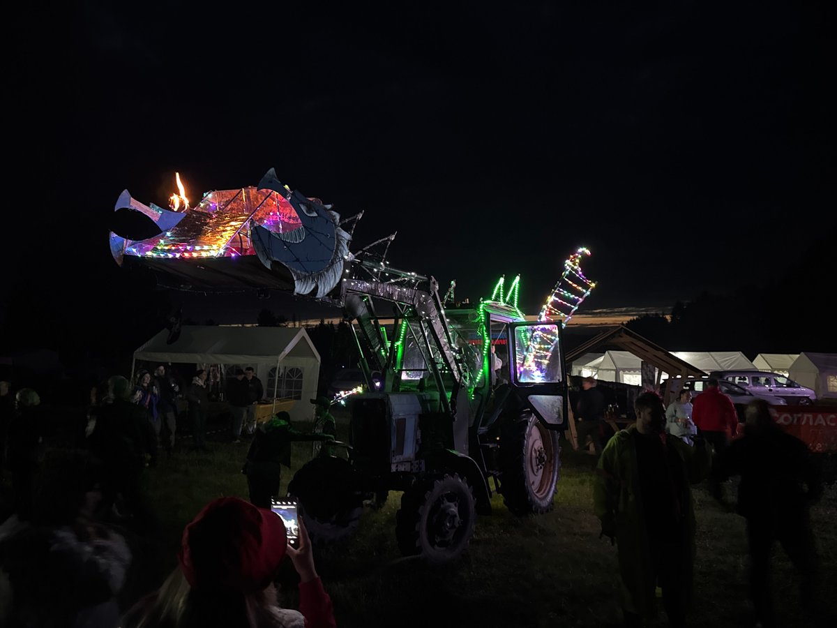 Modified tractor draws crowd to nighttime gathering in Russian town