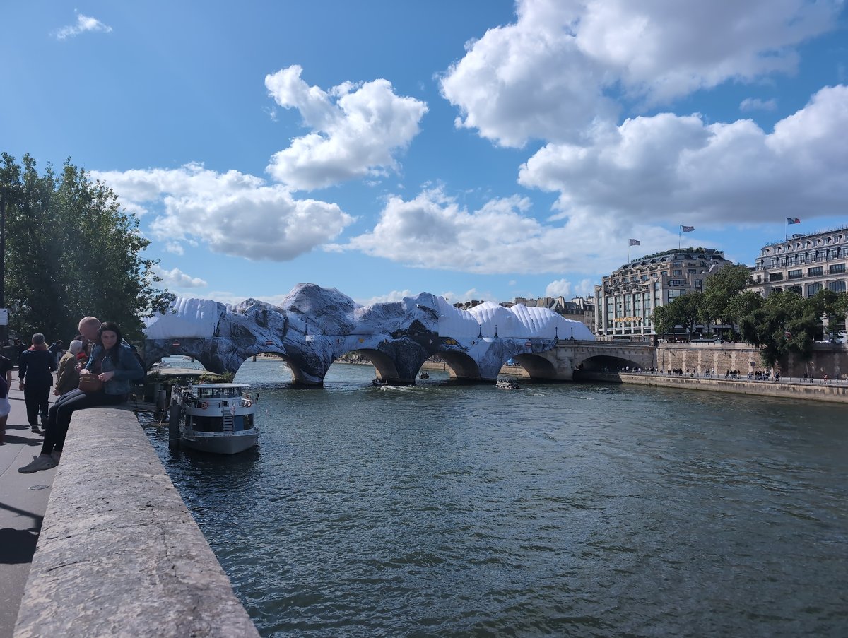 Paris bridge displays temporary decorations over Seine River
