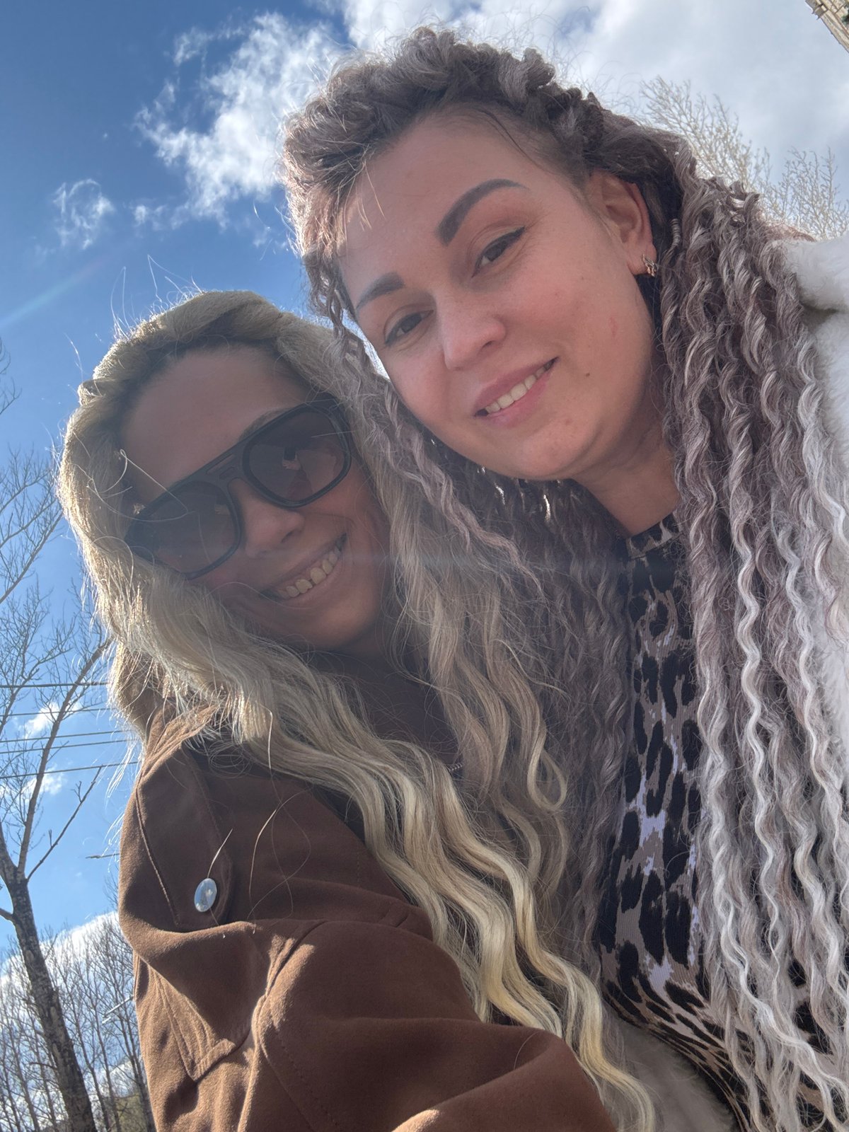 Two women take sunny day selfie in rural Russia