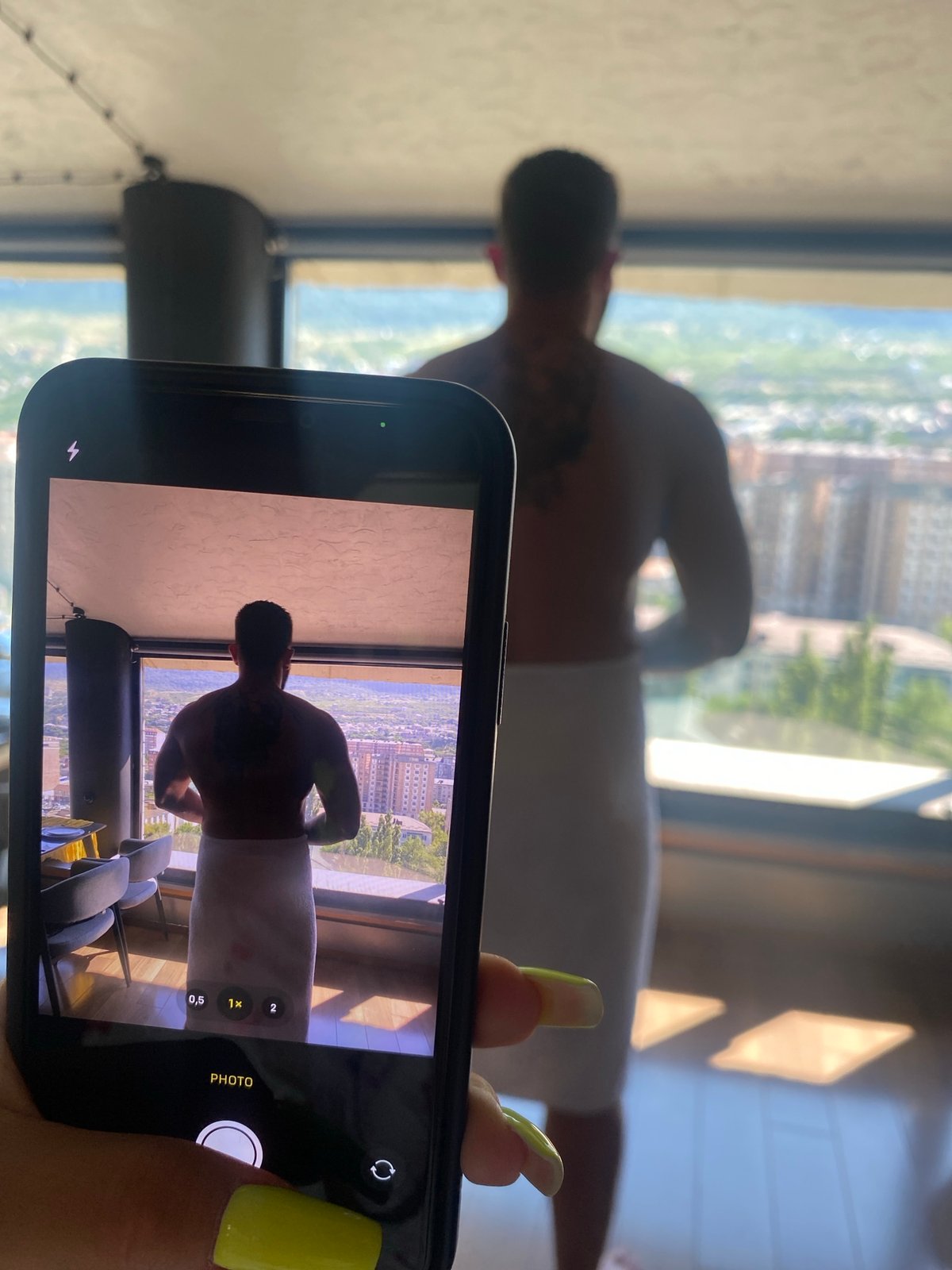 Getting ready in Makhachkala, city views through the window