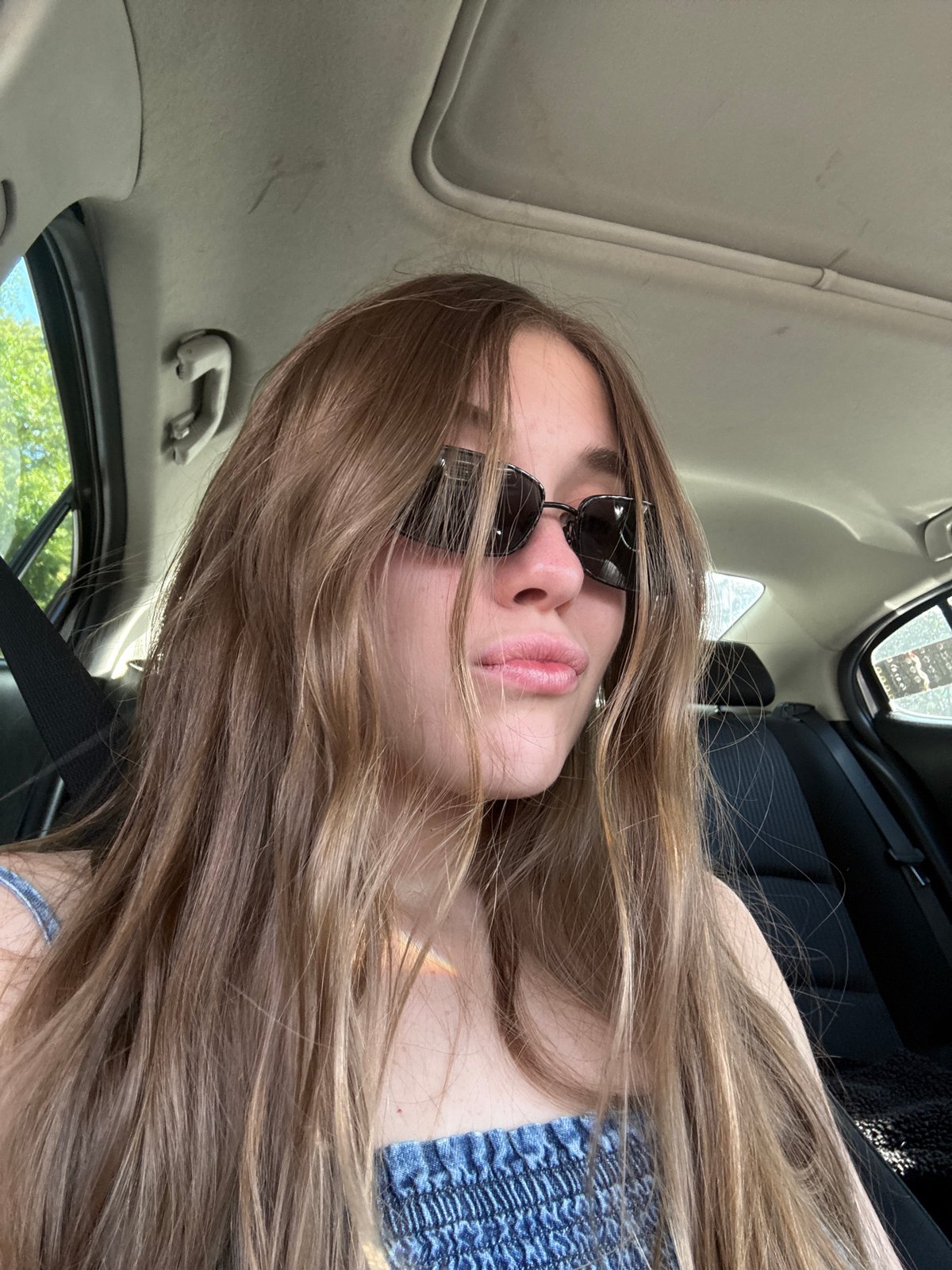 Woman in sunglasses observed in car in Mexico City