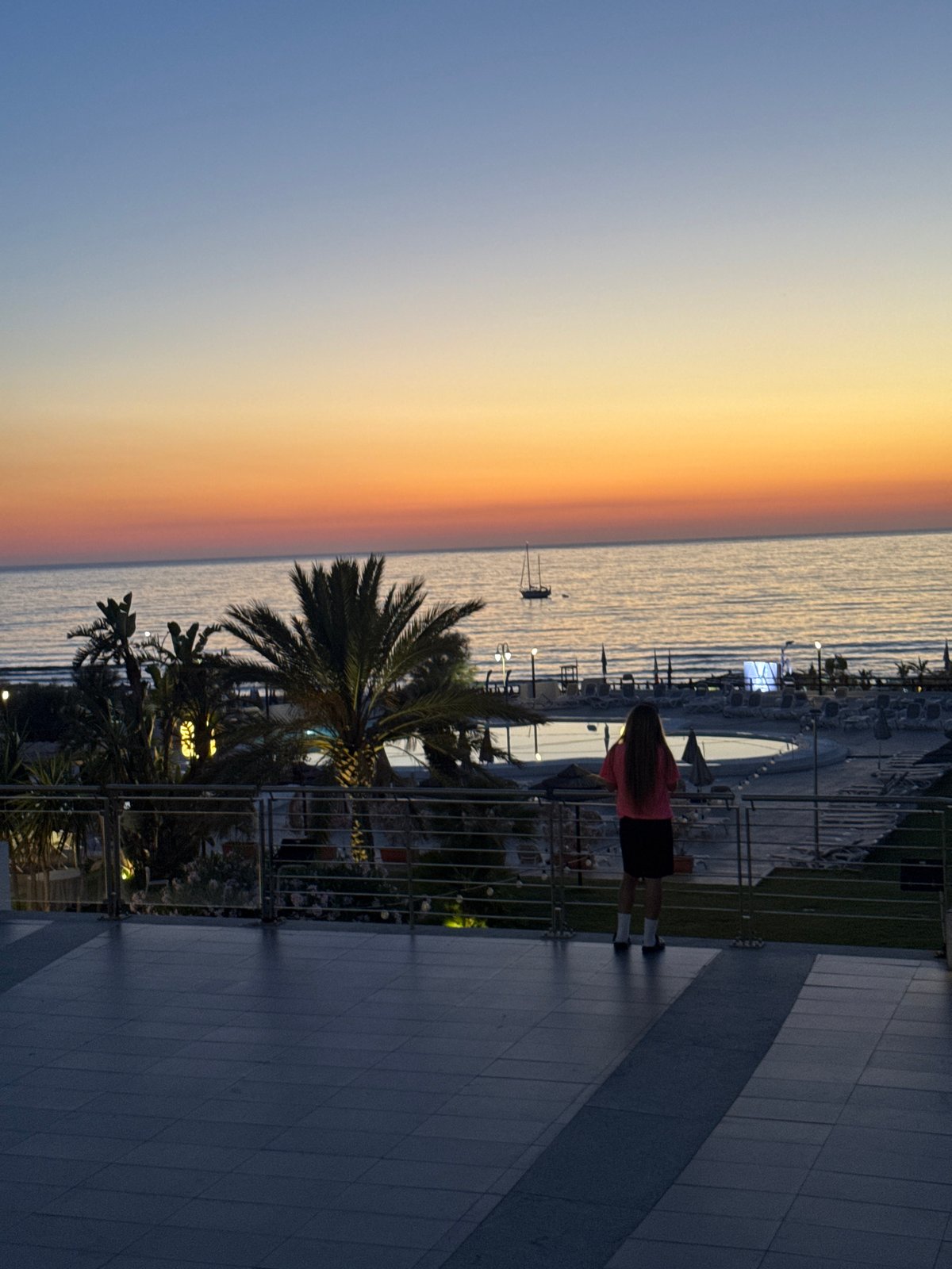 Mediterranean sunset from a Sicilian resort, cat included