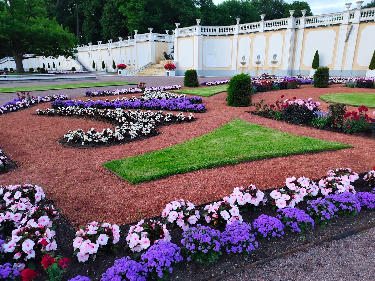 Evening stroll through a formal ornamental garden with fountains