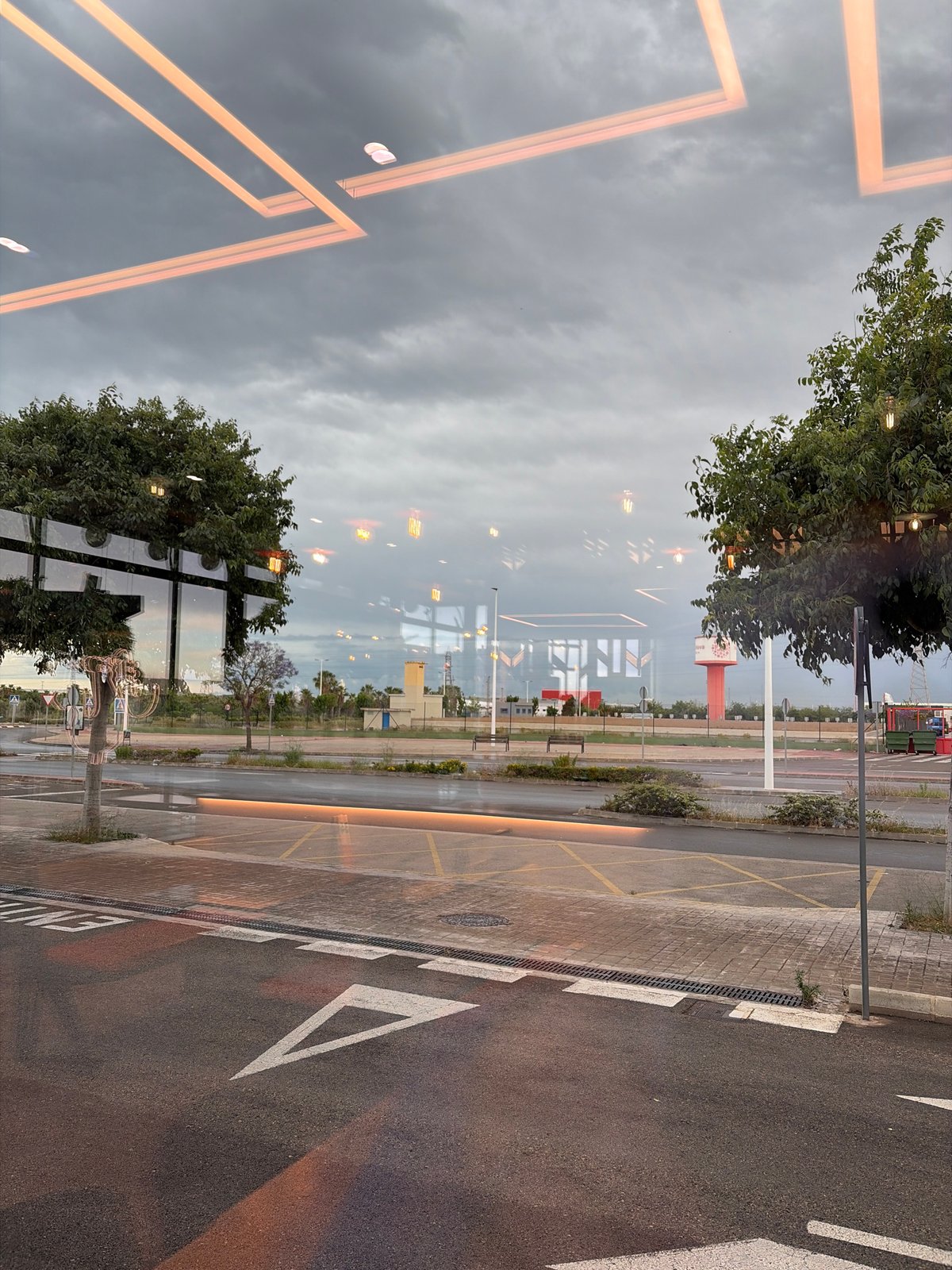 Street scene reflected in glass surface captured in Sagunto