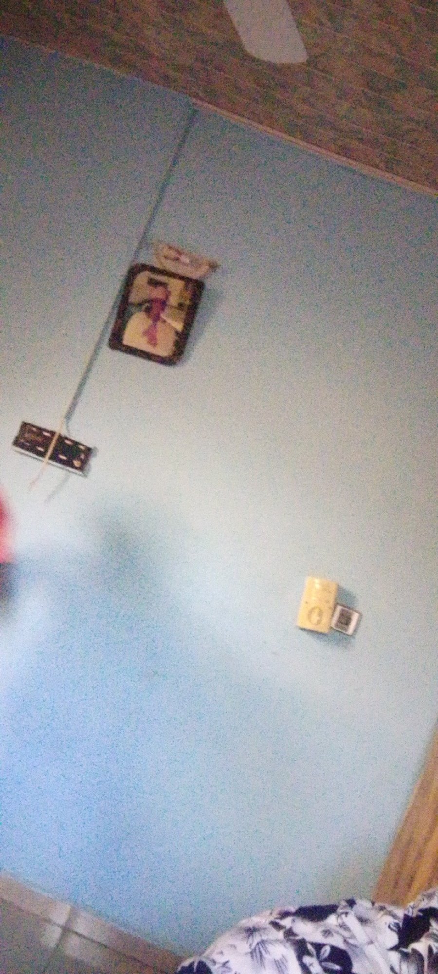 A quiet morning: wall decor and a casual peace-sign selfie