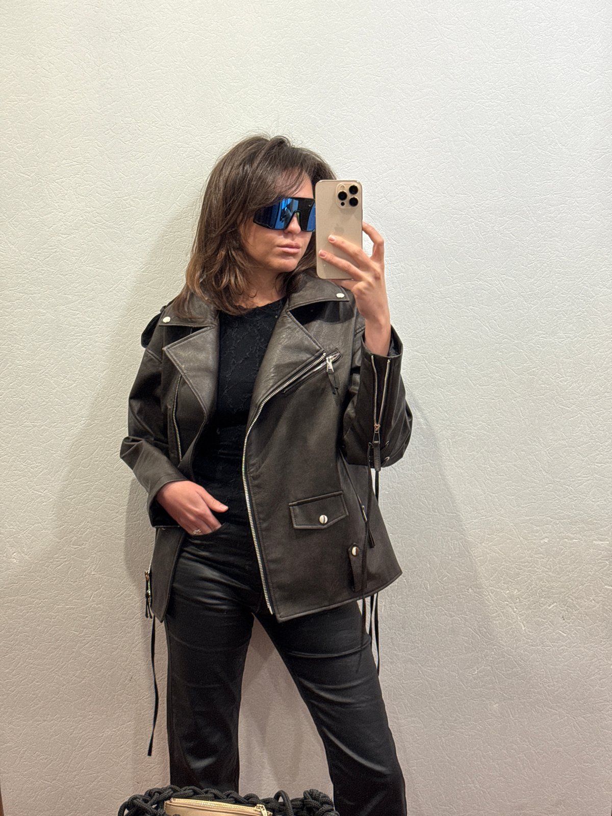 Person takes selfies in leather jacket, Krasnoyarsk