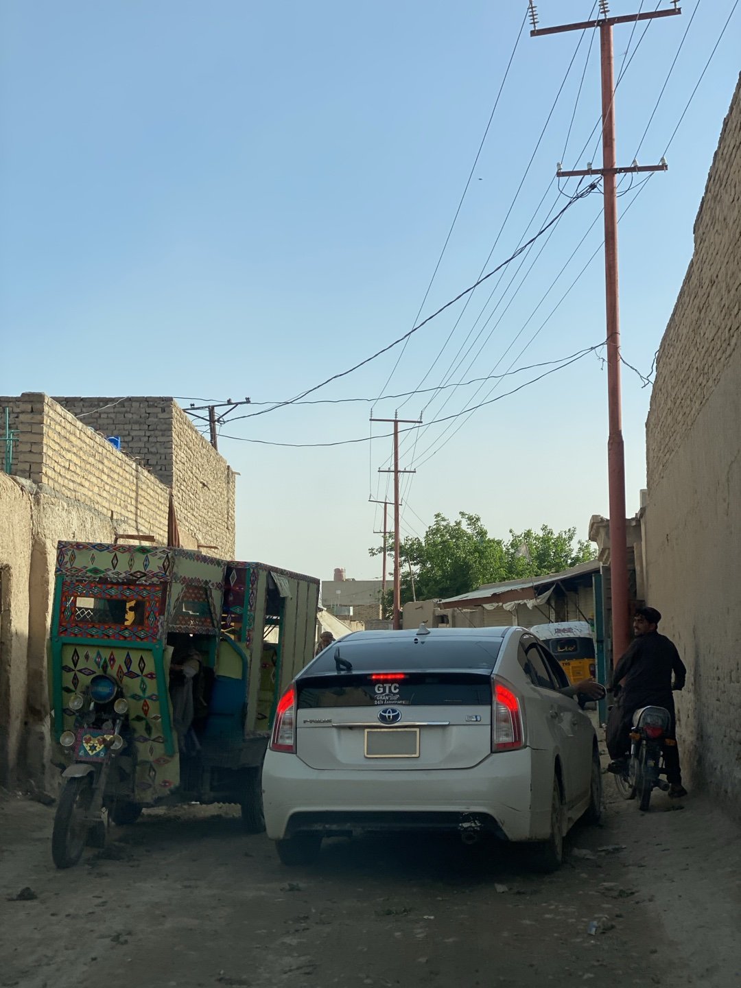 Daily life captured on Kandahar streets, traditional dress observed