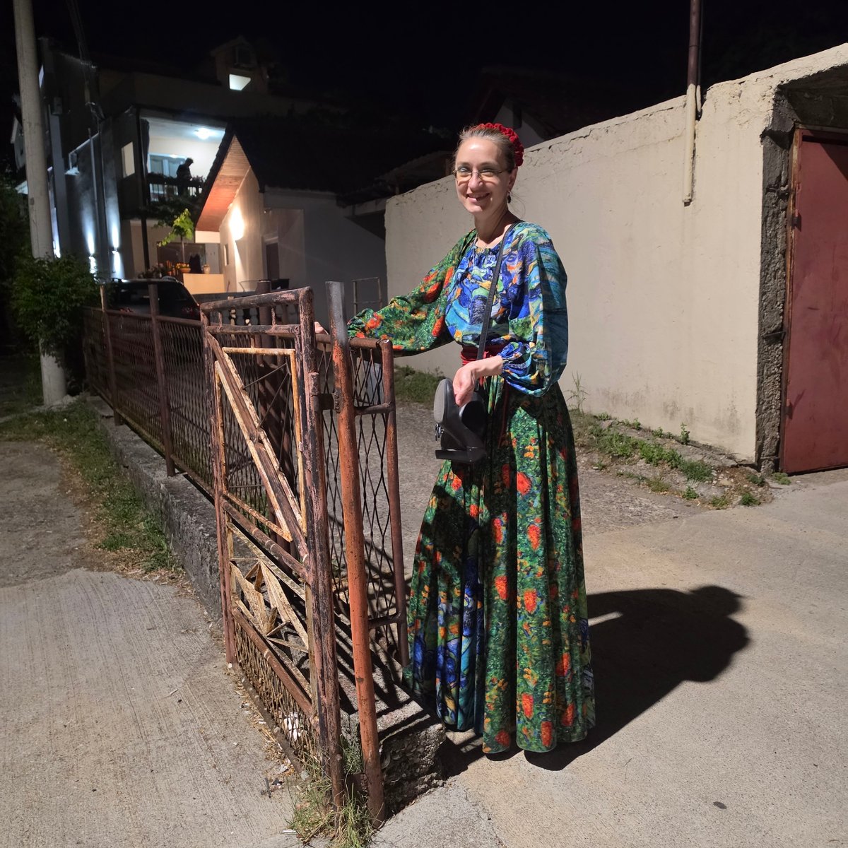 Woman in floral dress spotted near iron gate in Podgorica