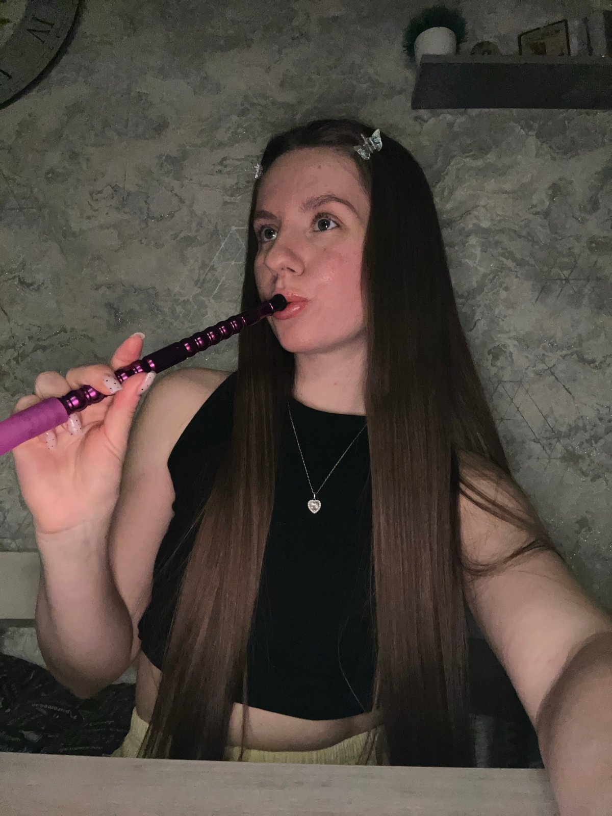 Woman smoking hookah indoors in Klin, Russia