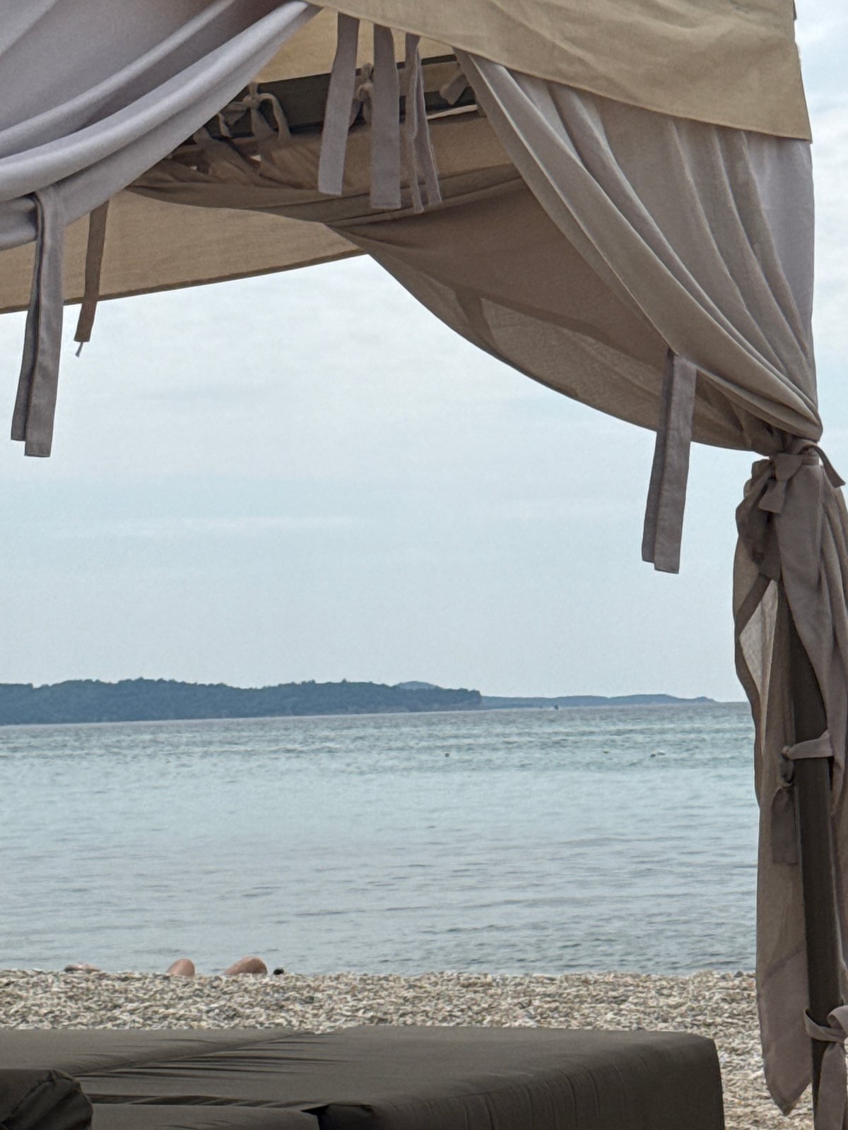 Lazy morning at a pebble beach resort in Limenaria, Greece