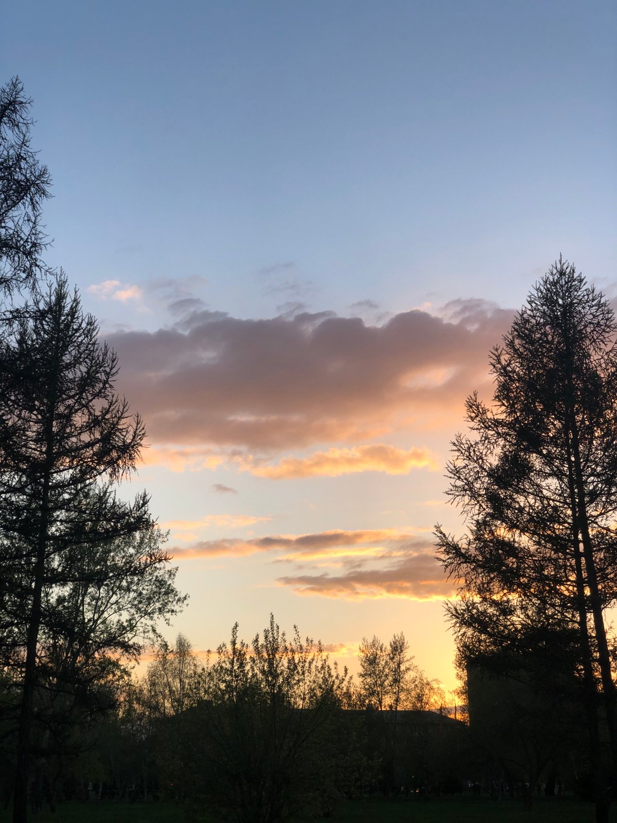 Sunset observed in Krasnoyarsk with orange-blue sky transition