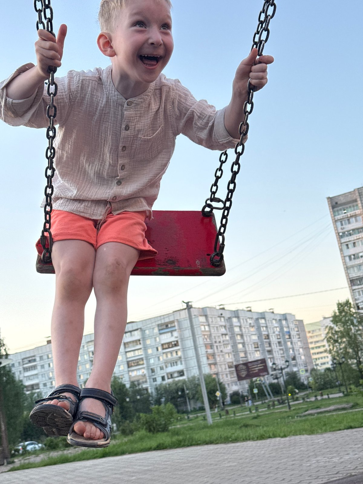 Children play at Chaikovsky playground during late afternoon sunset