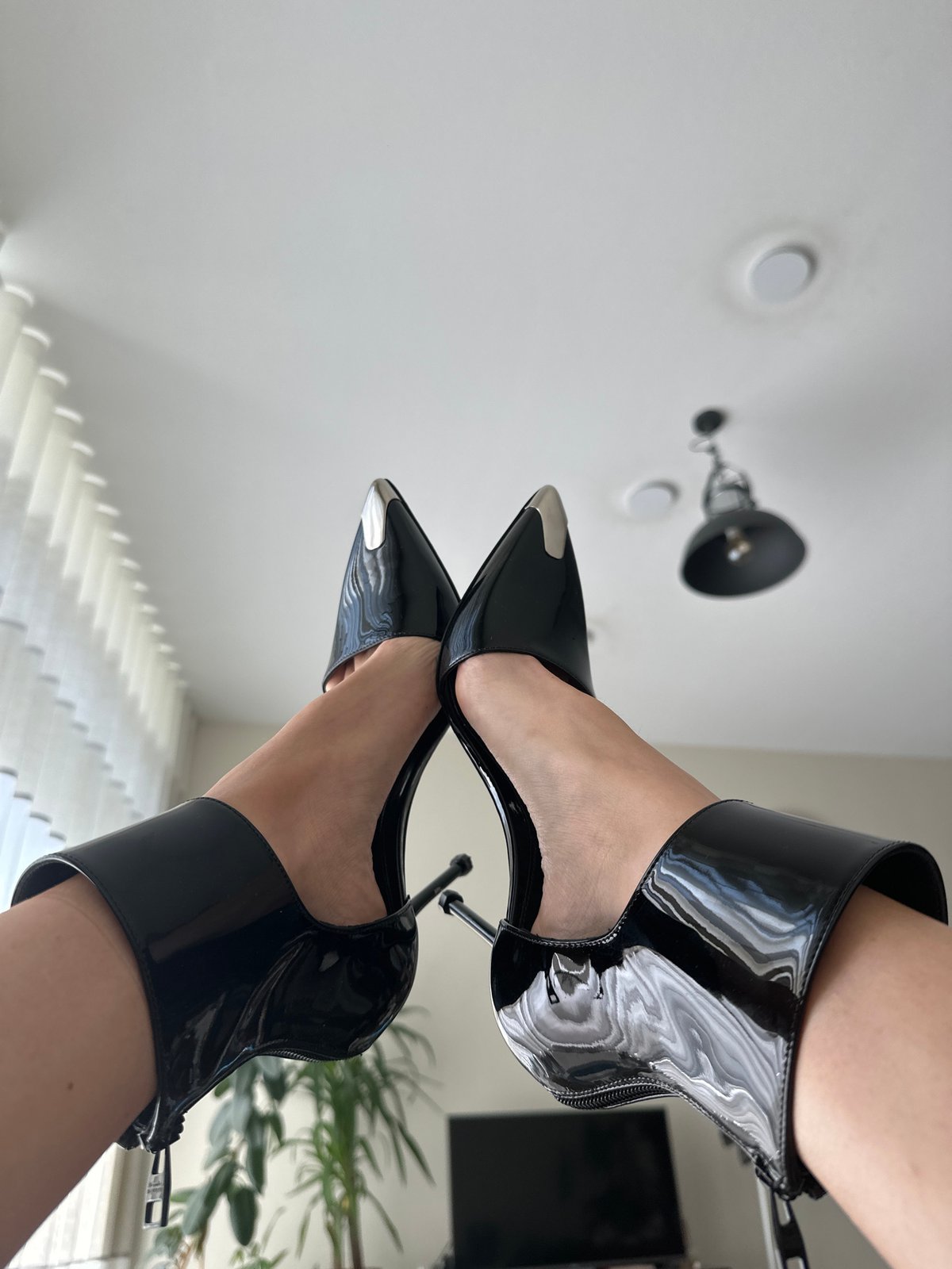 Black patent heels styled and shot close-up in Amsterdam
