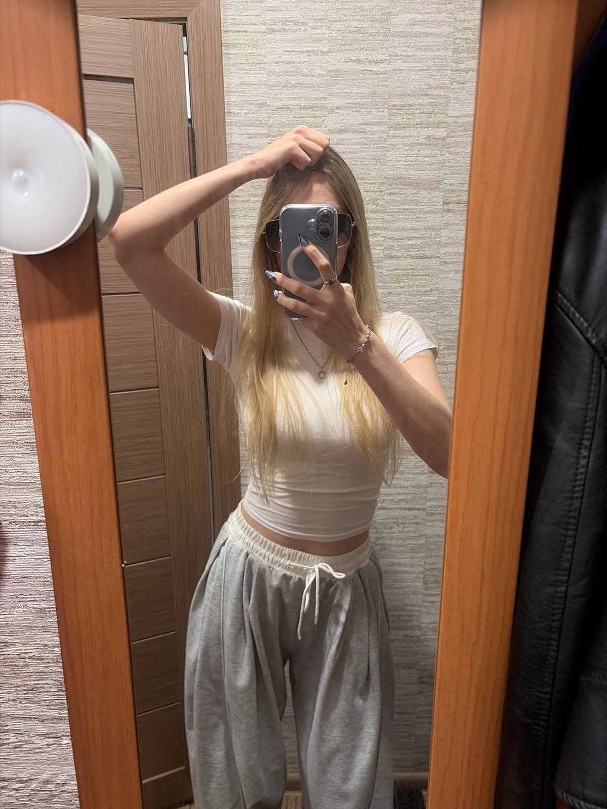 Mirror selfie and outdoor shot, same outfit, one minute apart