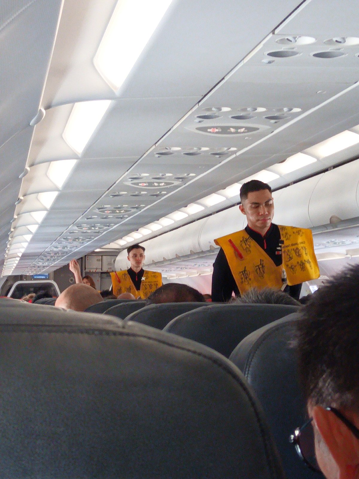 AirAsia flight taxiing at a tropical airport