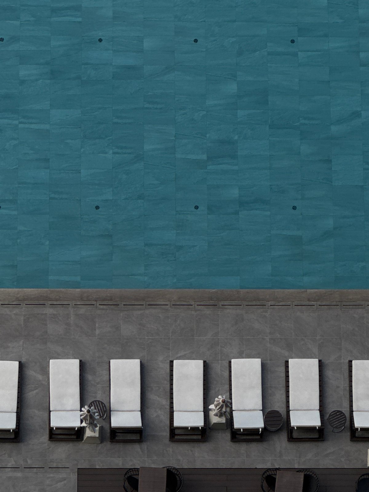Bangkok rooftop pool views with city skyline and dining