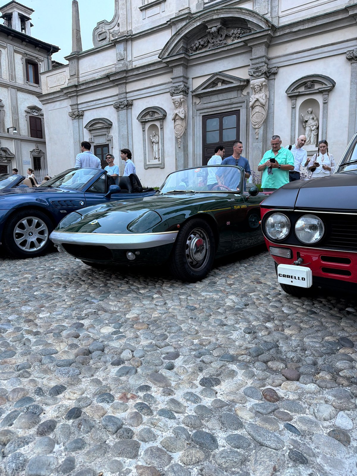 Classic car meetup on Milan cobblestones, pizza included