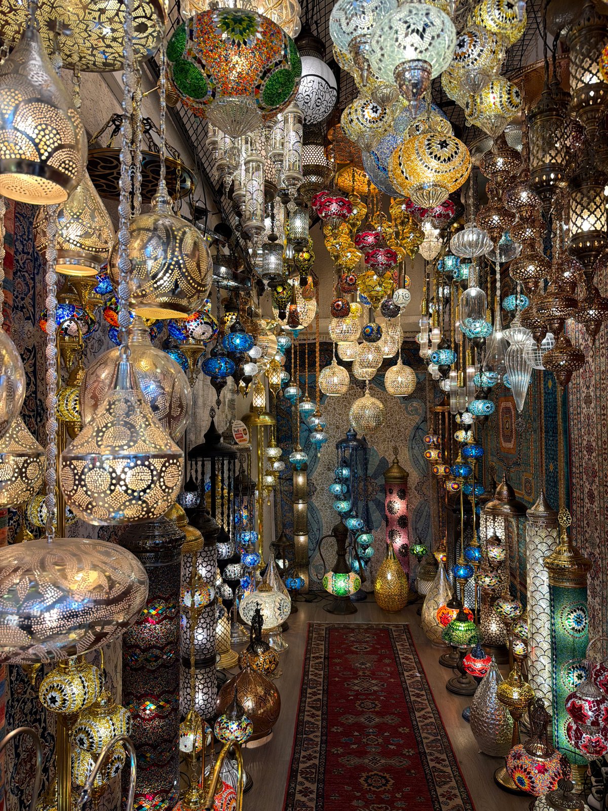 Tourist captures traditional Turkish lamp and carpet shop interior