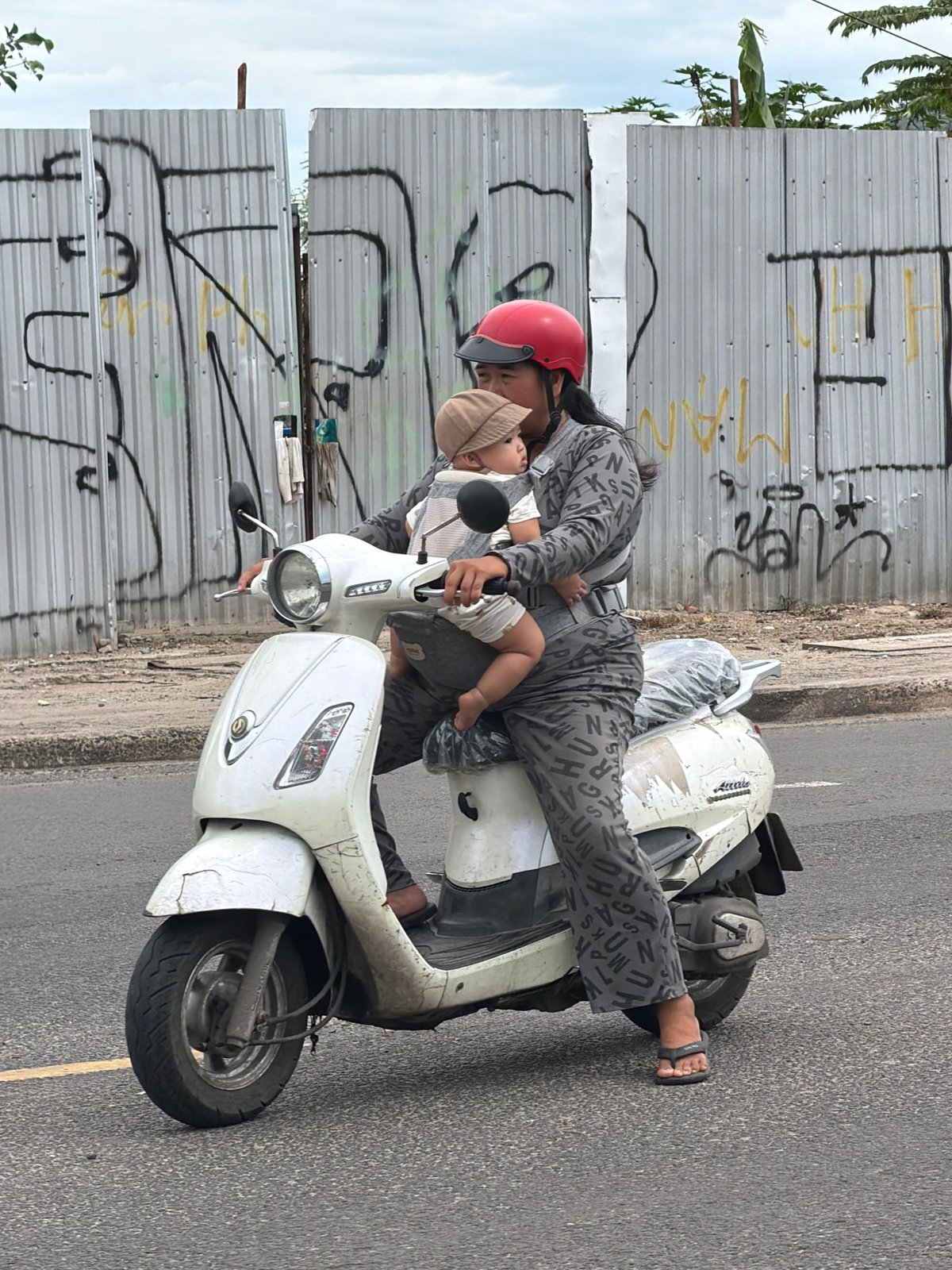 Scooter traffic flows through a Nha Trang street