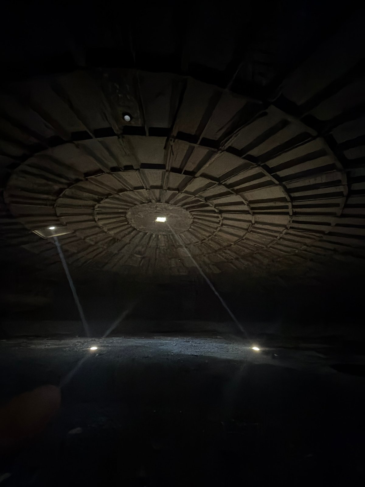 Visitor documents circular architecture at Tbilisi History Museum