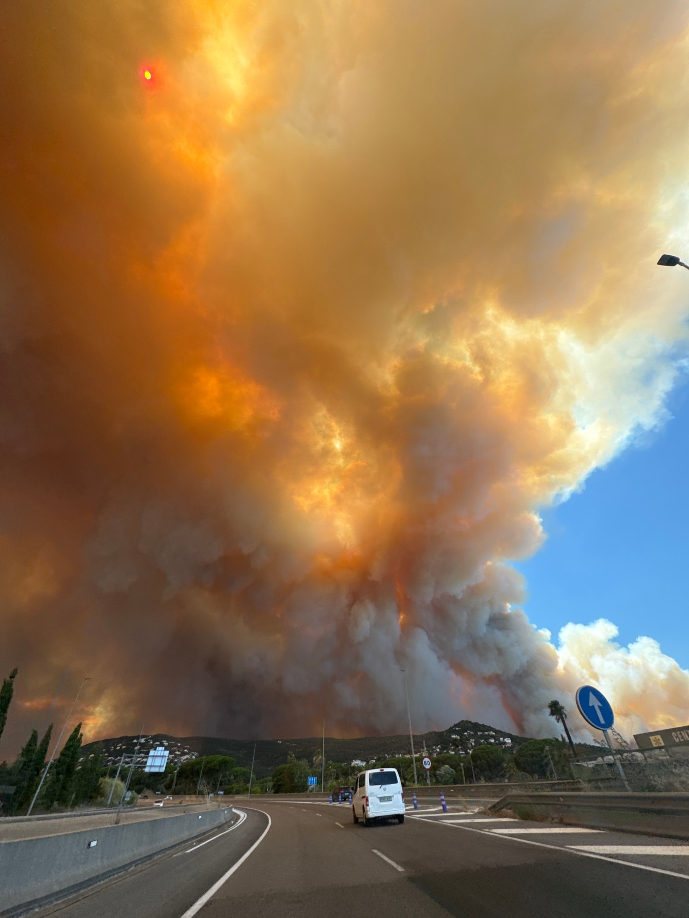 Dense wildfire smoke blankets the sky over Calonge i Sant Antoni