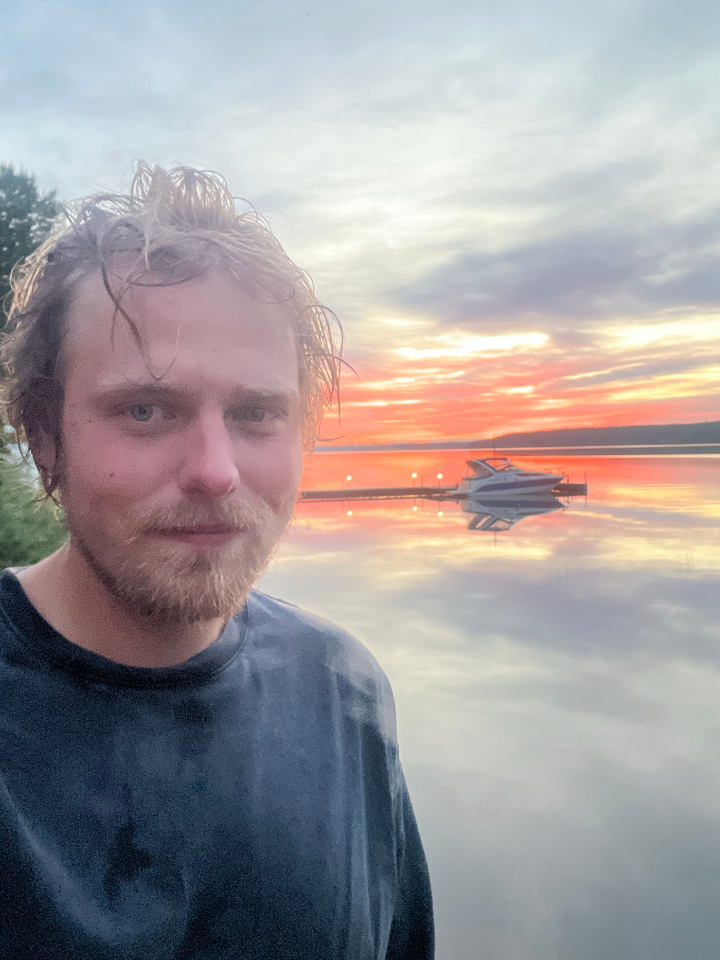Evening picnic gathering concludes at sunset near water