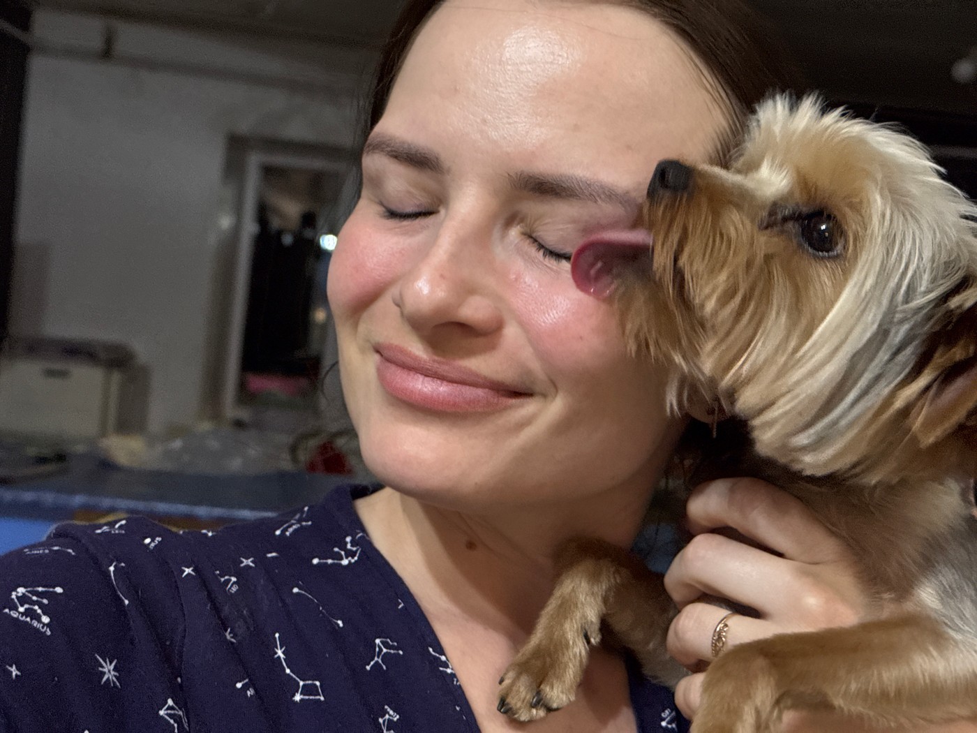 Pet owners share tender moments with small dogs in Rusalevka