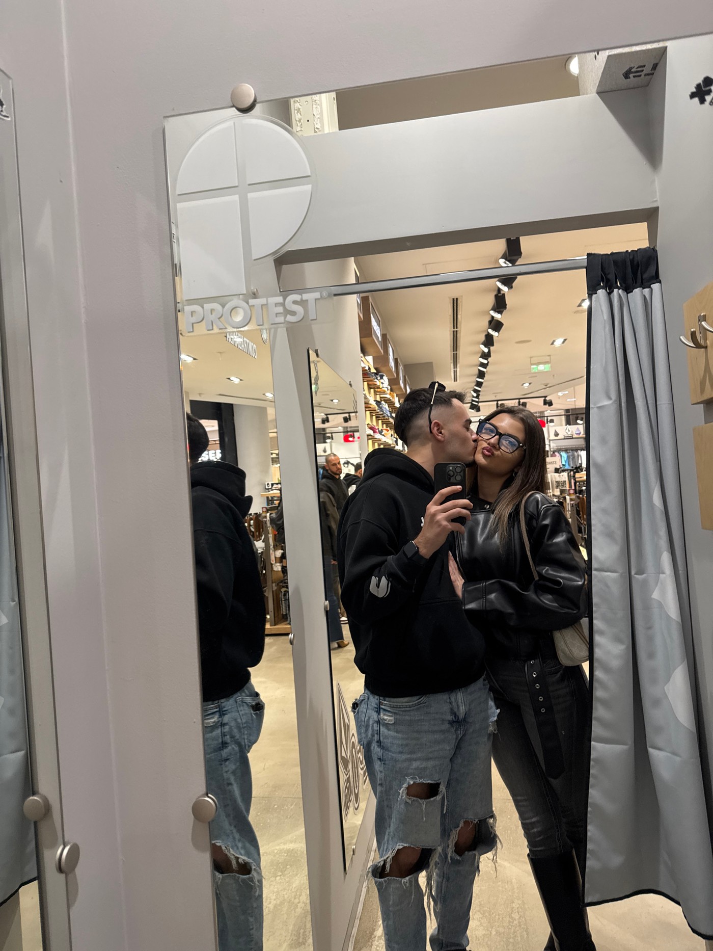 Couple takes selfie in Sofia shoe store