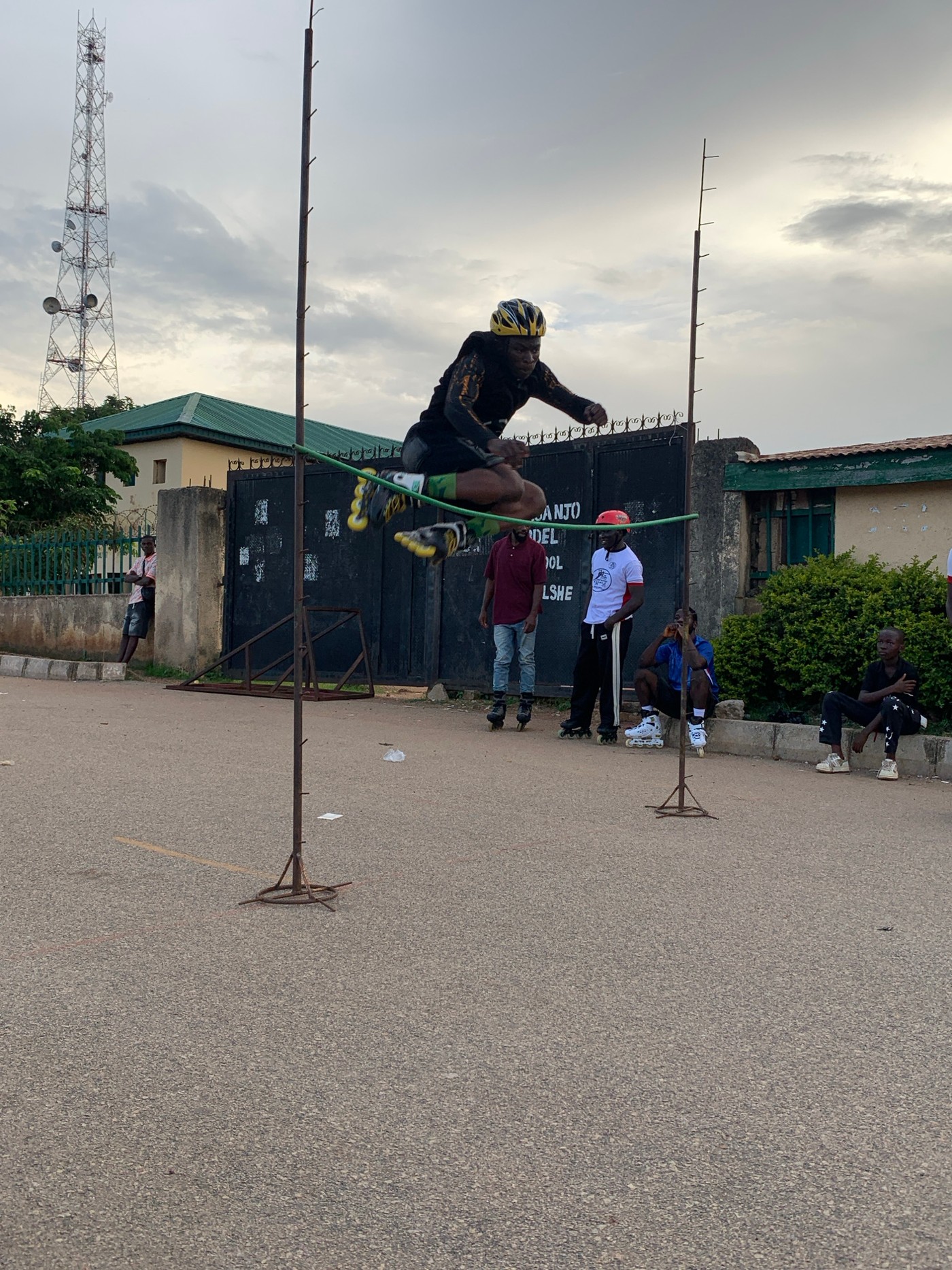 Rollerblade high jump competition outside a Jos school