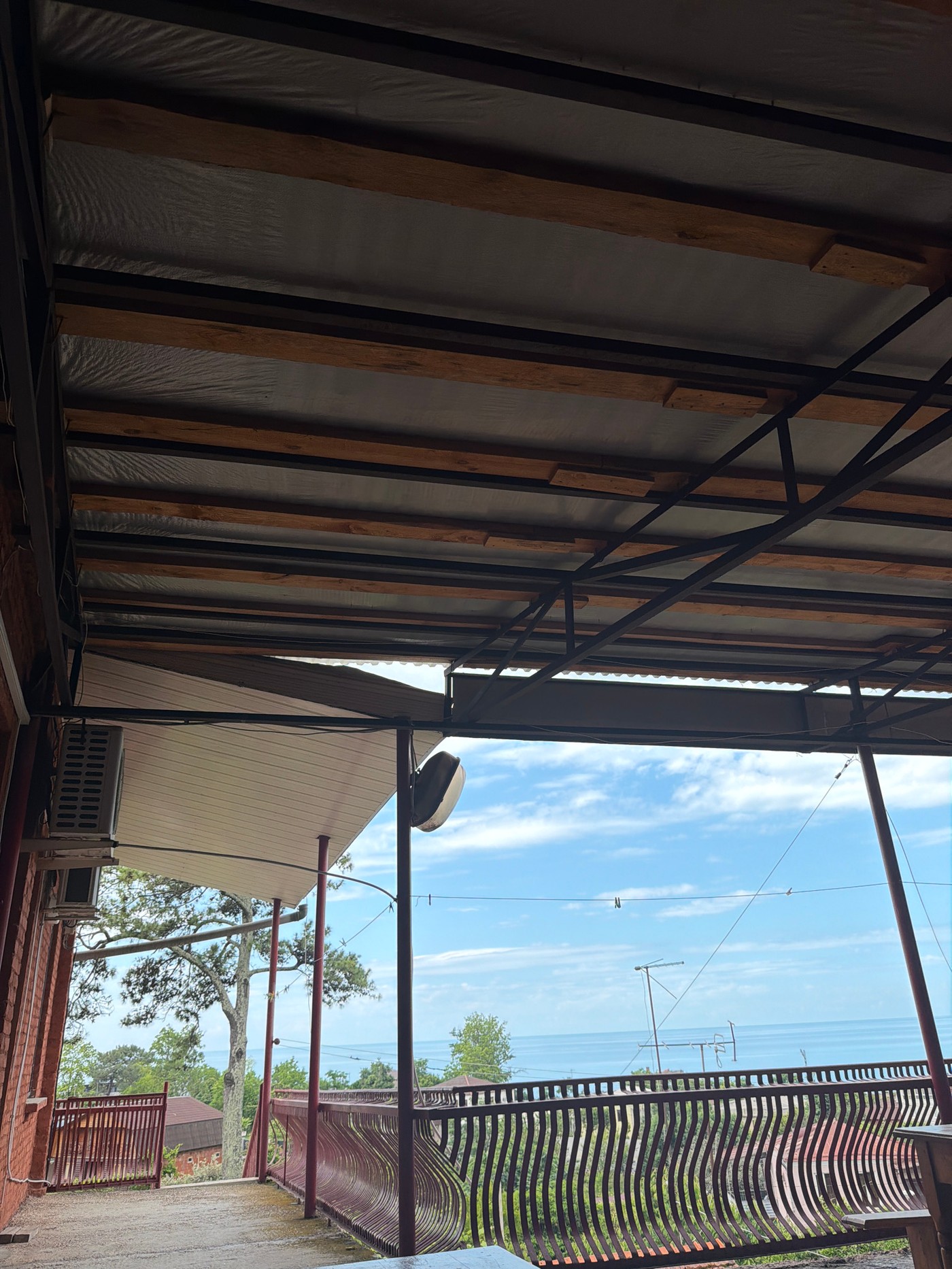 Morning documentation of coastal home details by single witness