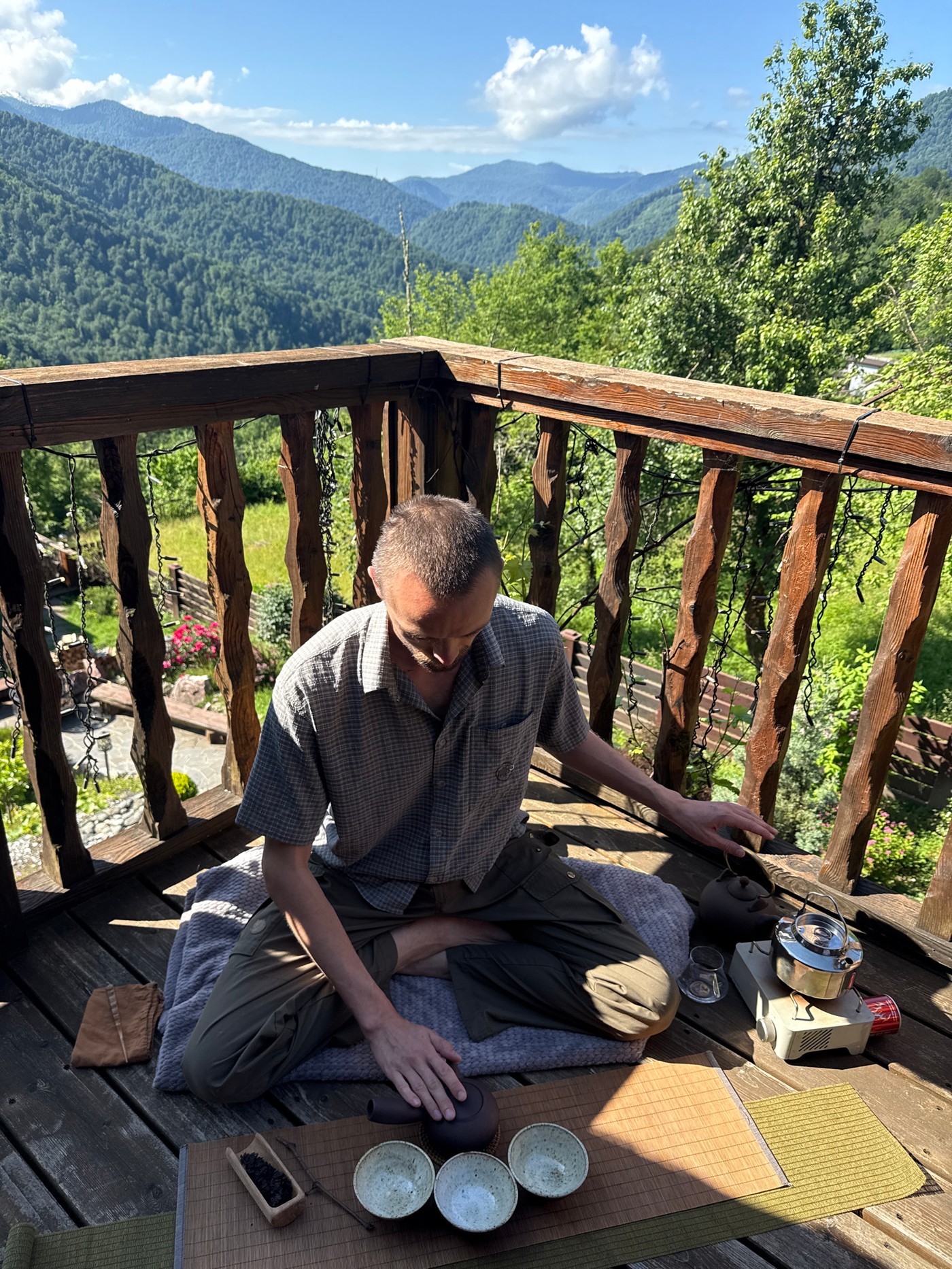 Morning tea ceremony and yoga session in Russian mountains