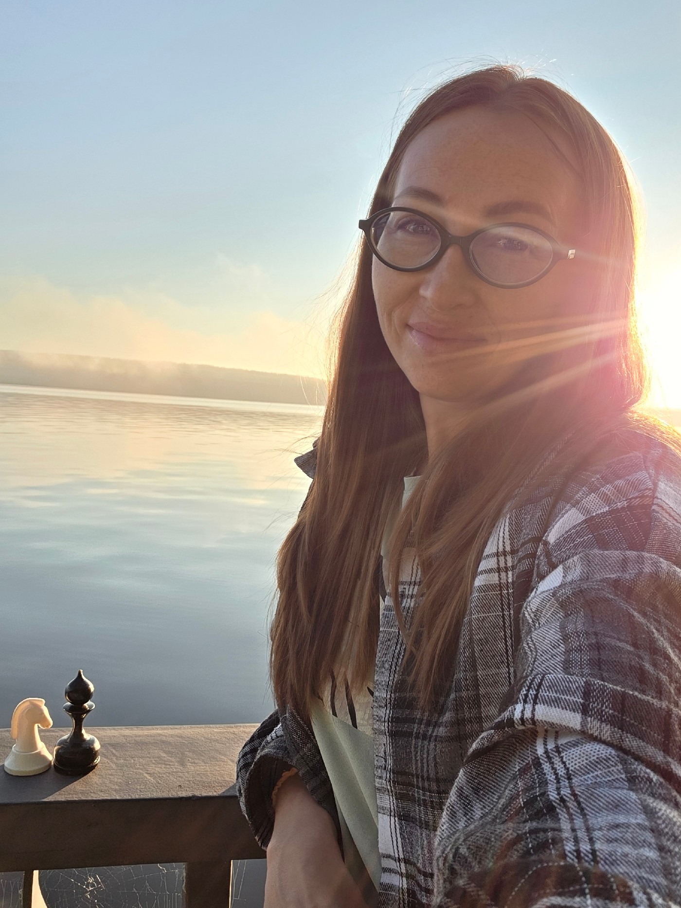 Checkers game at a Chaikovsky waterfront on a sunny day