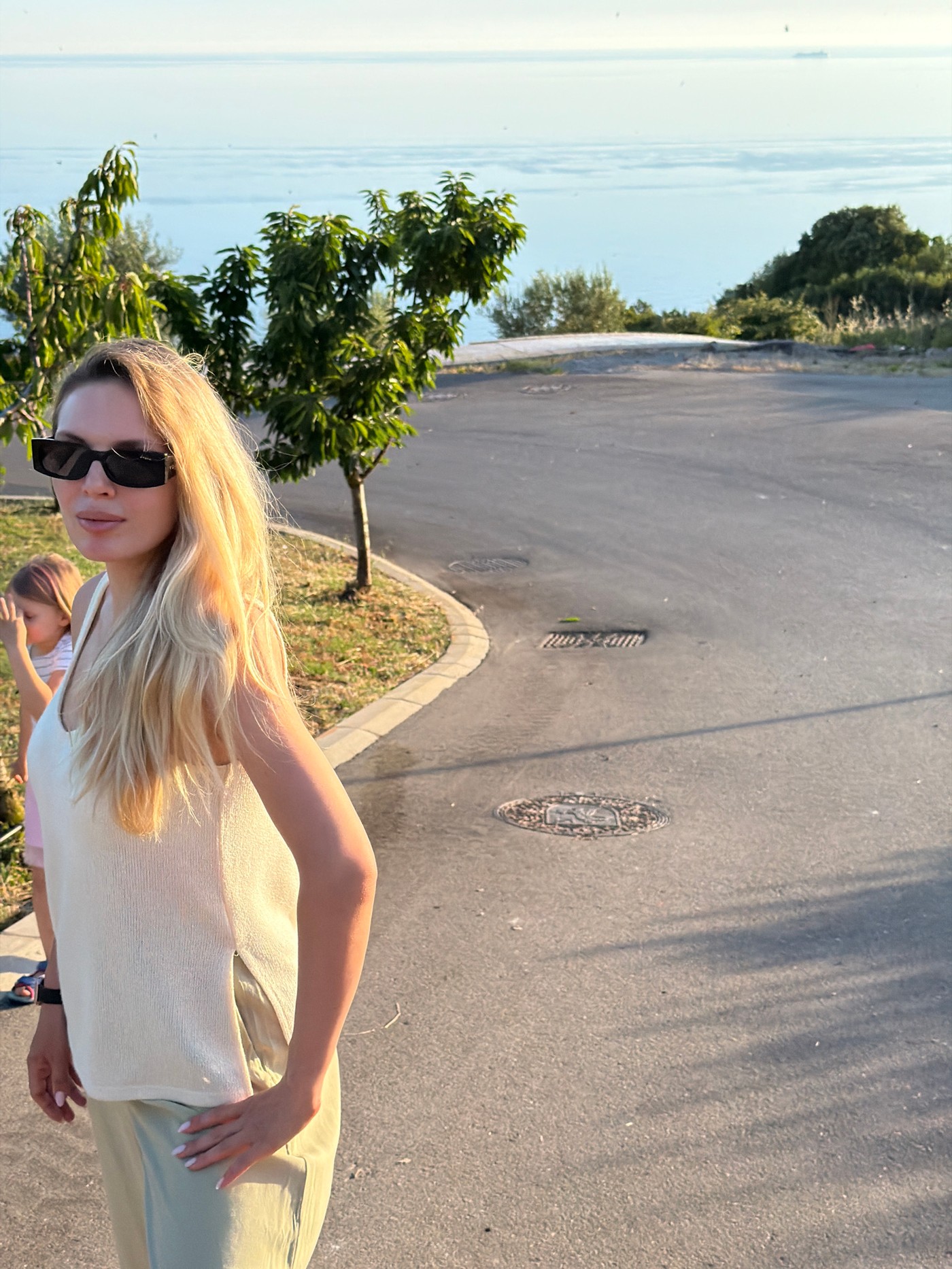 Mother and daughter enjoy sunset coastal visit in Montenegro