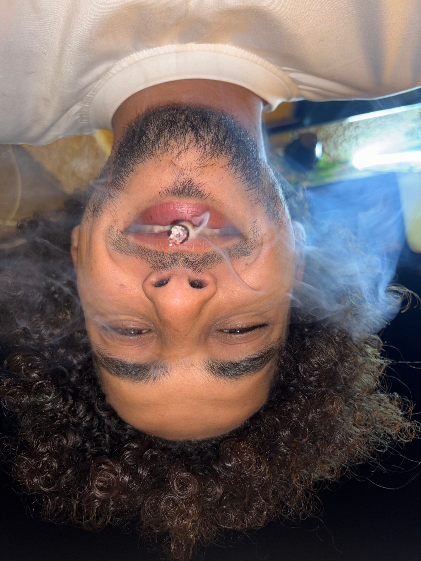 Young man photographed smoking cigarette in Tangier, Morocco