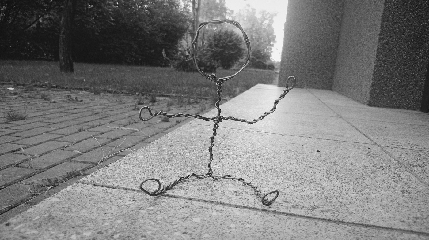 Wire figure sculpture photographed outdoors in Karviná, Czechia