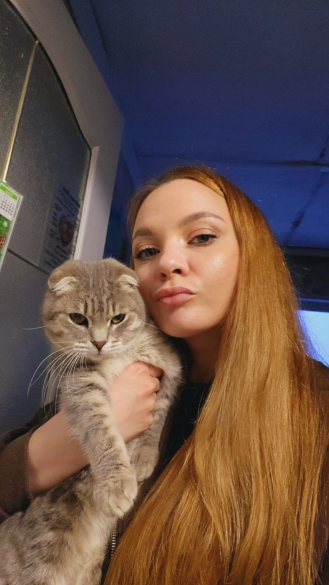 Woman takes selfies indoors in Зипуново, Russia