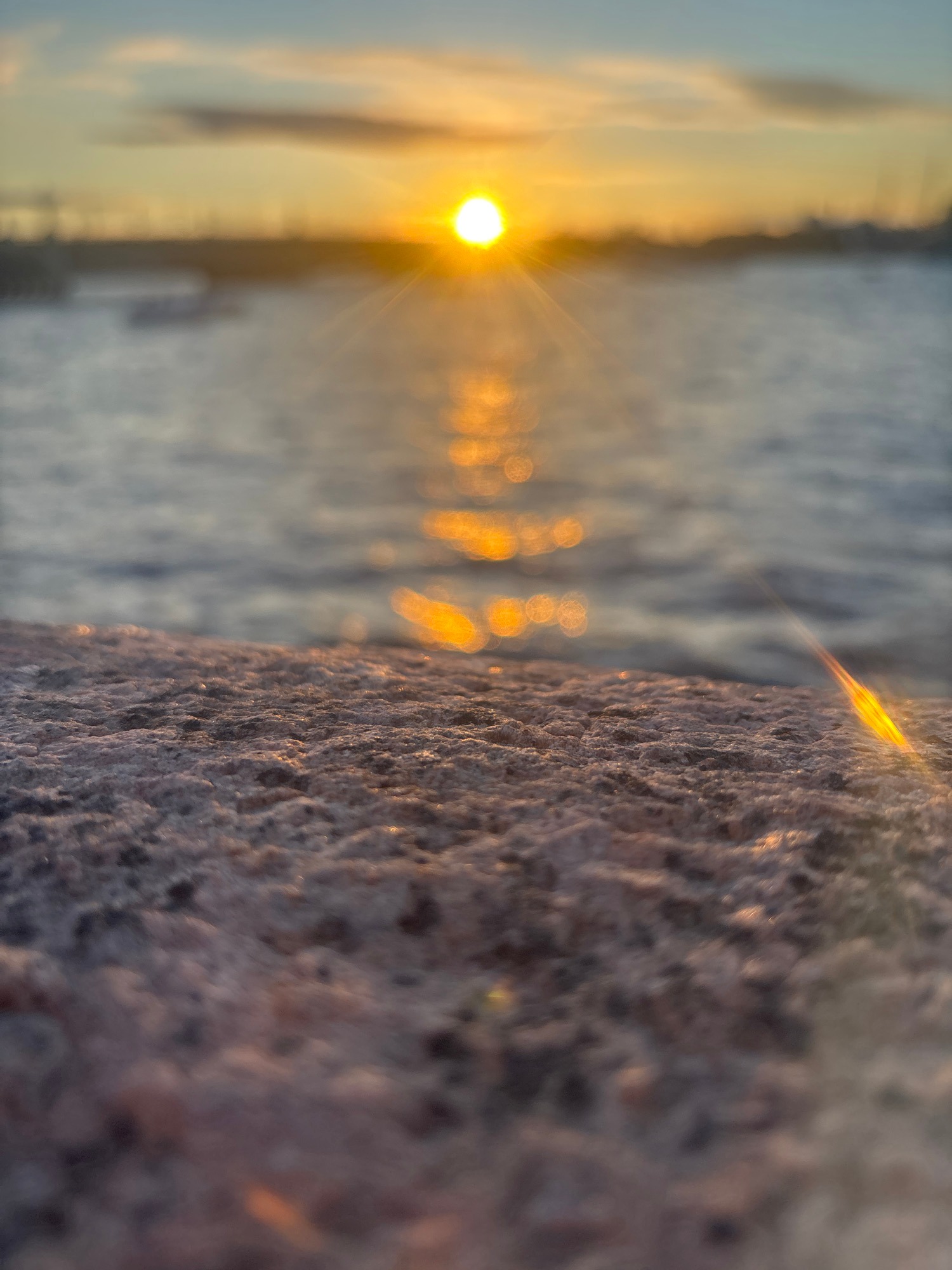 Coastal rock formation documented during sunset at ocean location