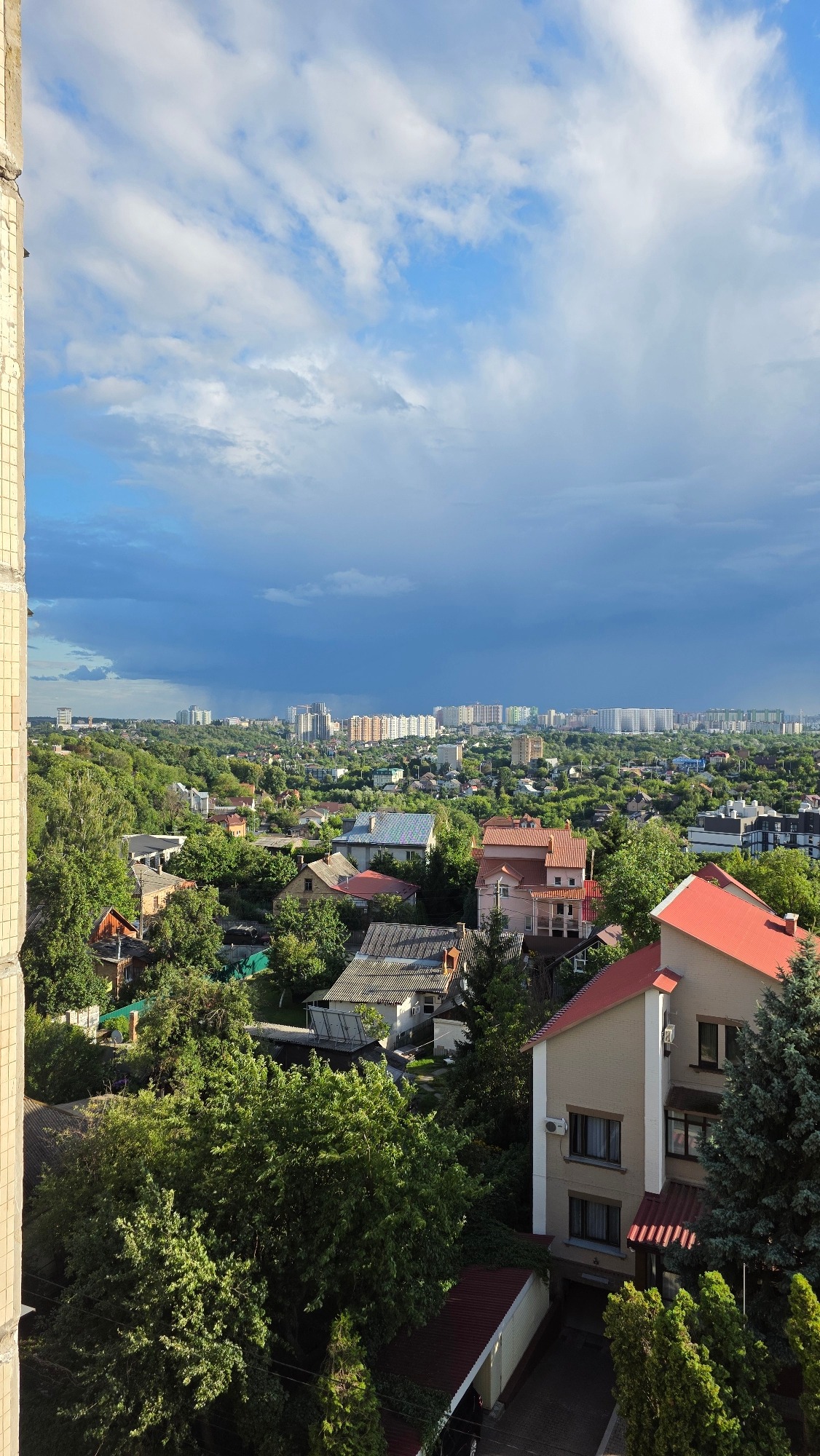 Aerial views of a city skyline as storm clouds move in