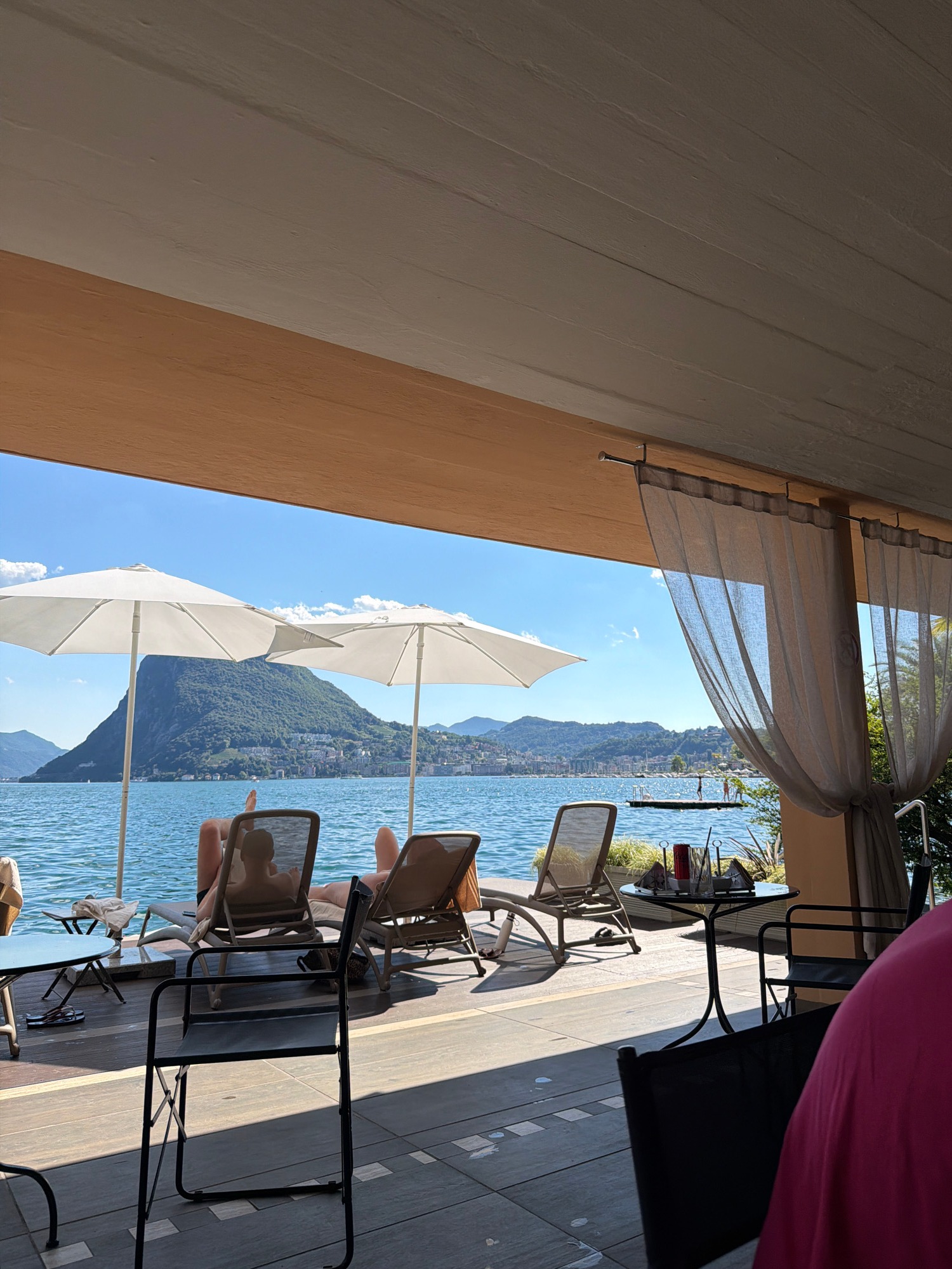 Lakeside patio downtime with drinks and mountain views