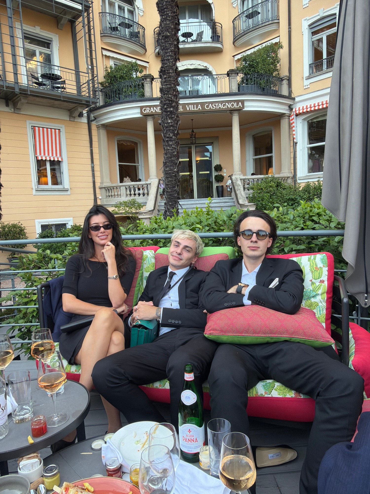 Formal outdoor gathering at a palm-lined venue