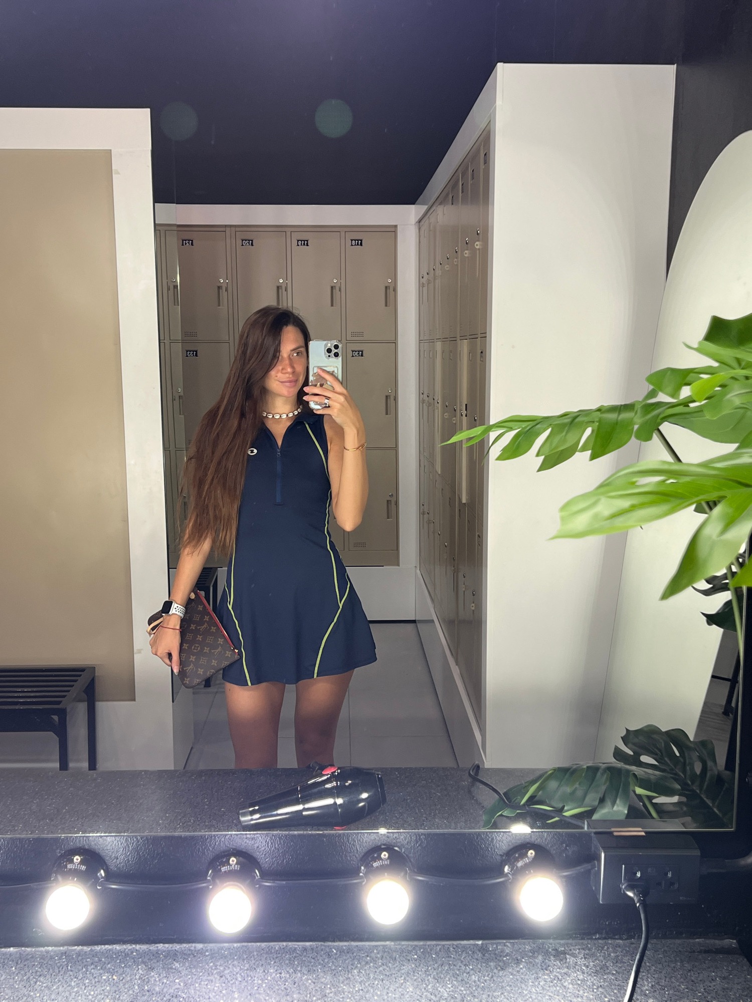 Locker room mirror selfie in a blue and yellow outfit