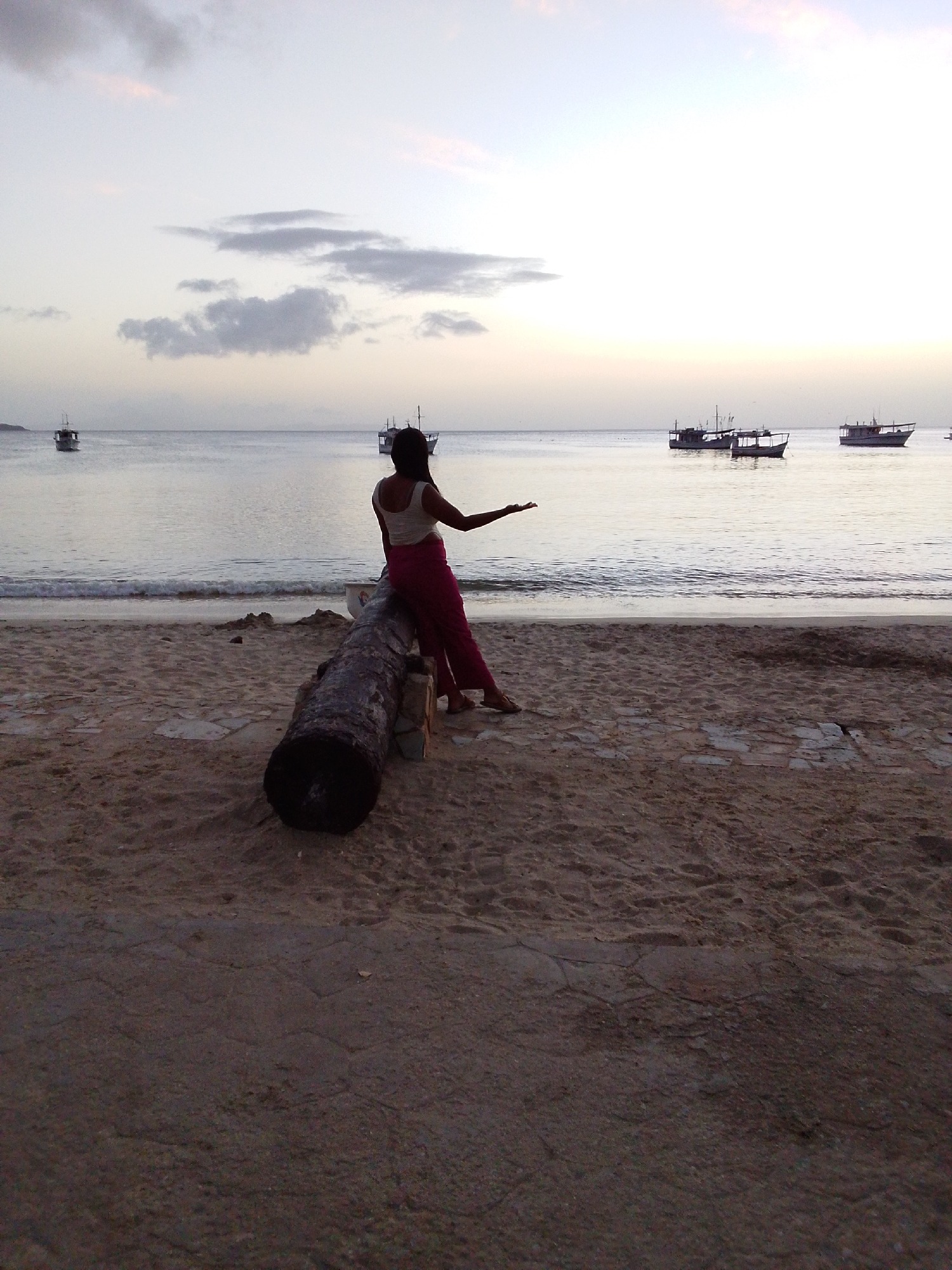 Sunset hour at a quiet tropical harbor and beachfront