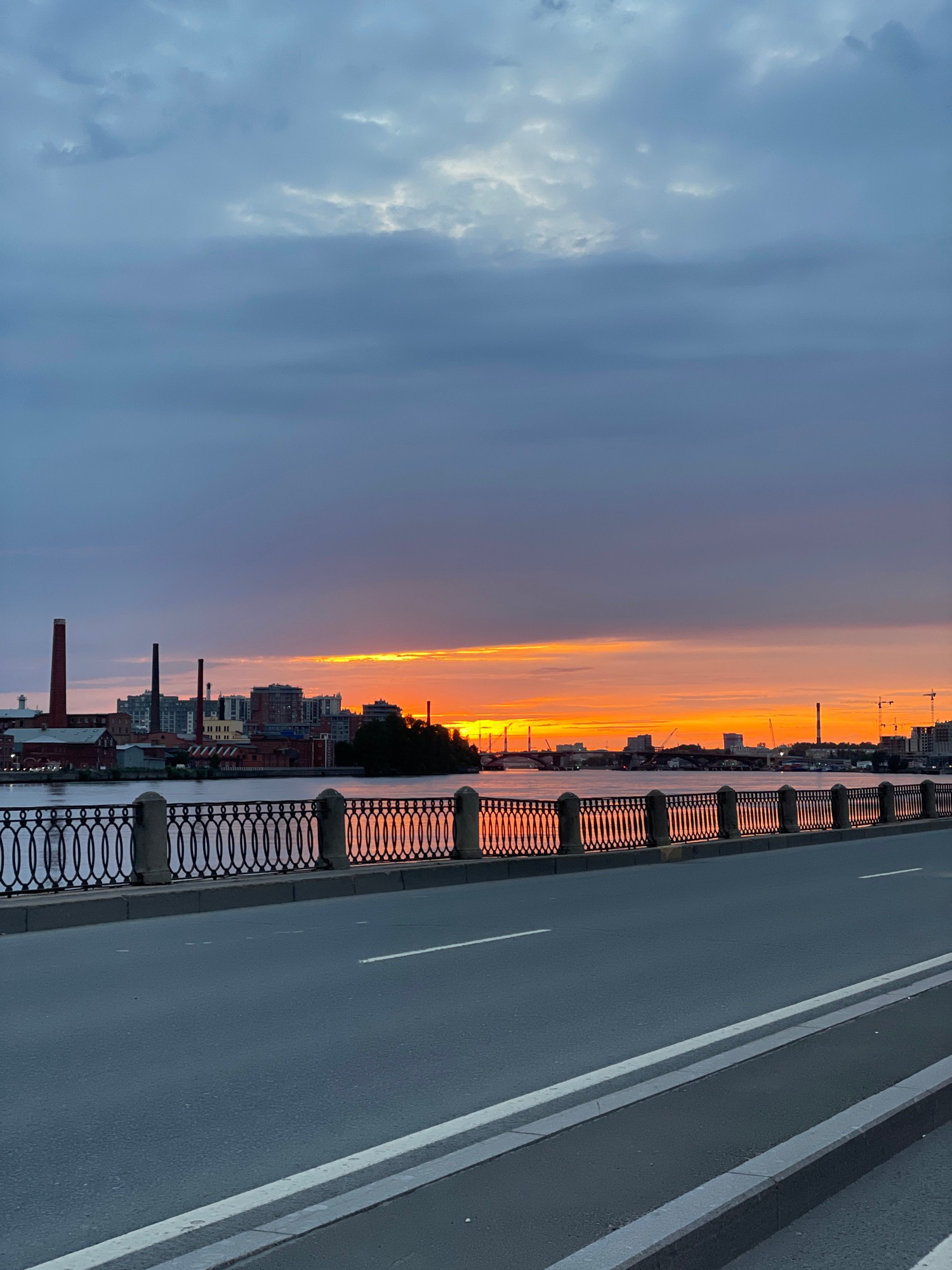 Sunset washes St. Petersburg skyline in orange light