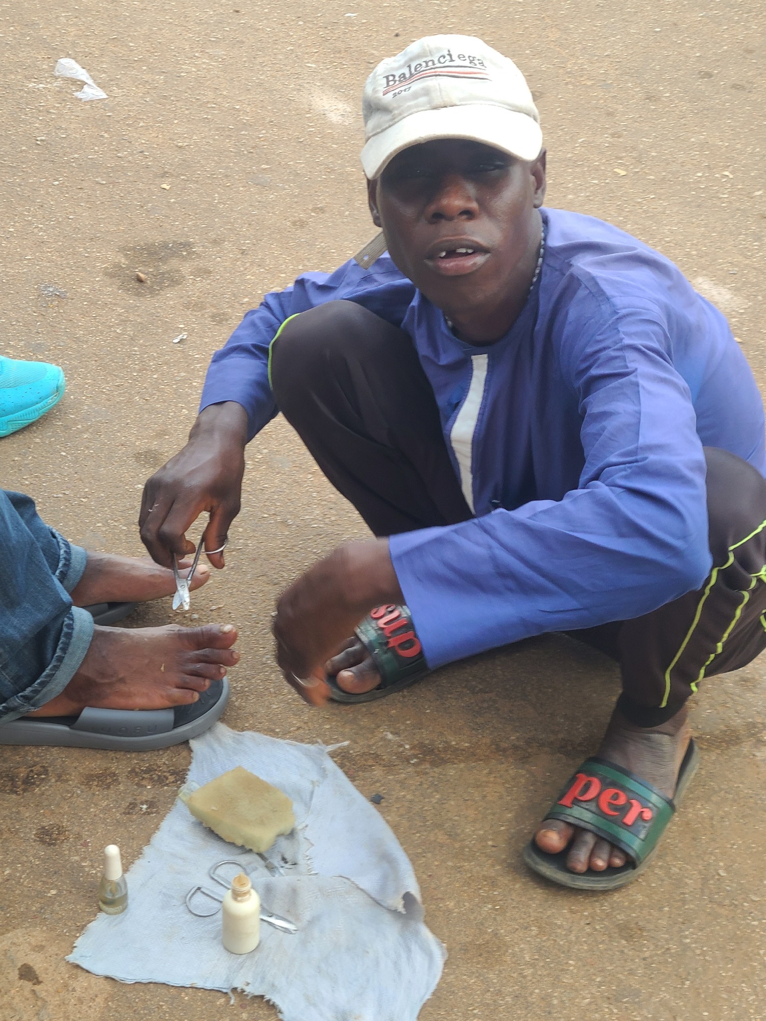 Everyday street life in a busy West African urban setting