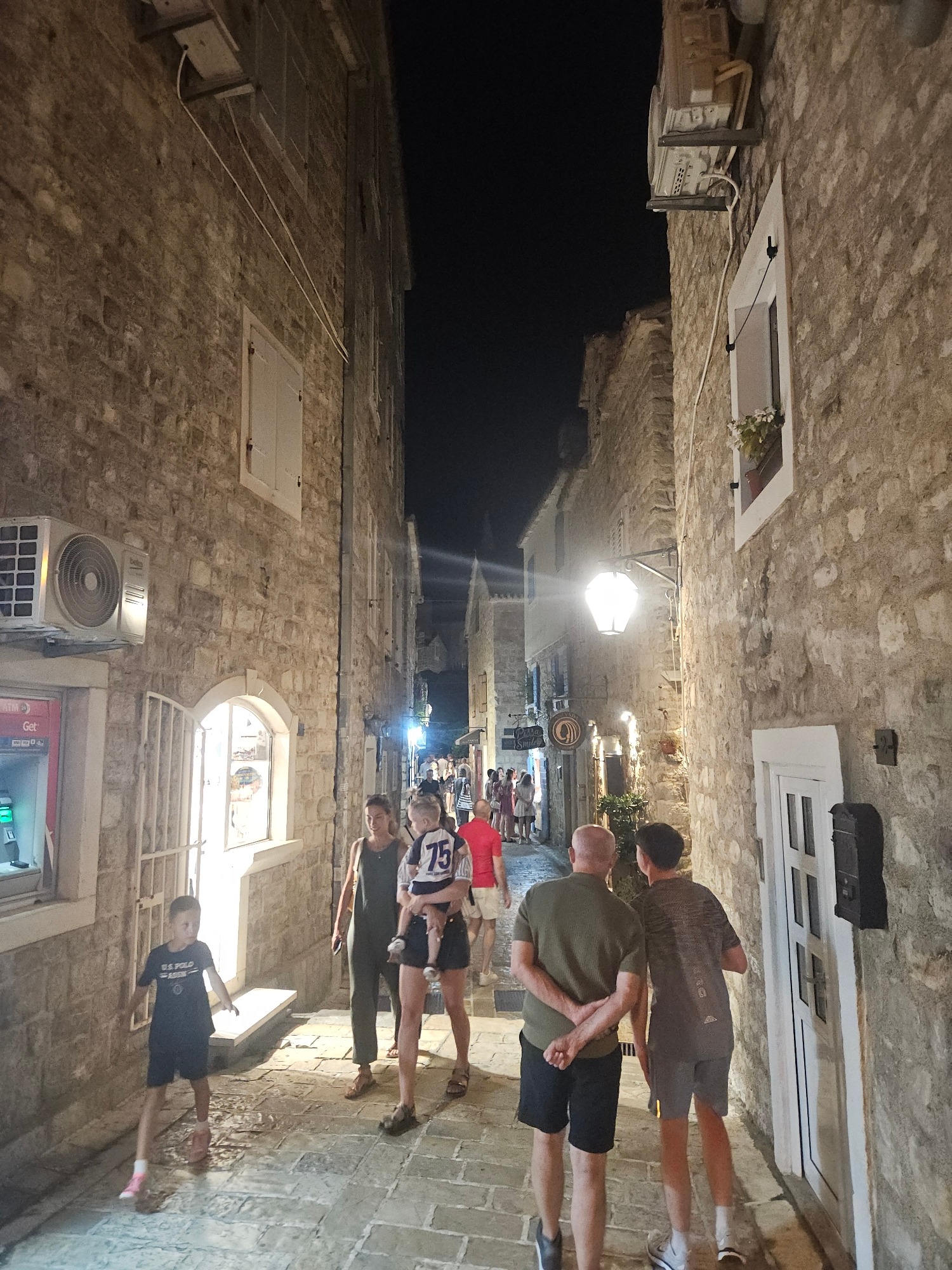 Mediterranean marina night: yachts, old town alleys, harborside pub